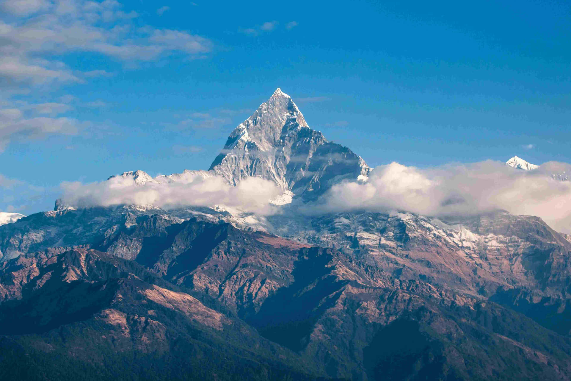 Majestic_ Mountain_ Peak_ Above_ Clouds.jpg Wallpaper