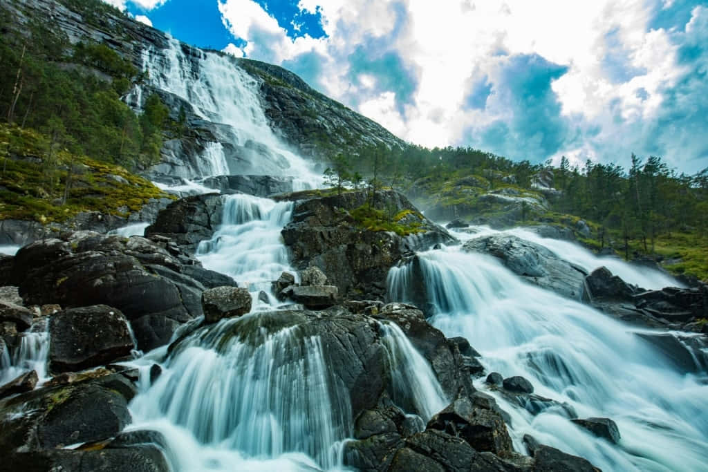Majestic Norwegian Waterfall Wallpaper