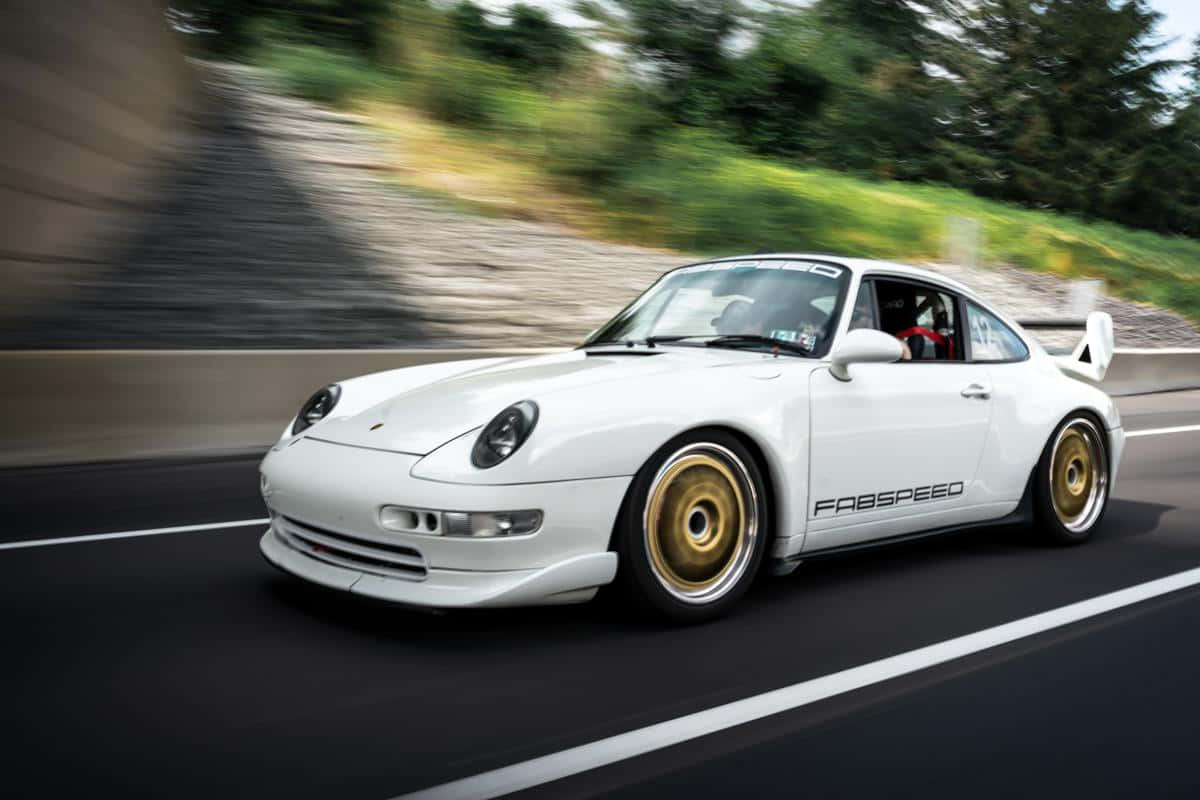 Majestic Porsche 993 Glows Under City Lights Wallpaper