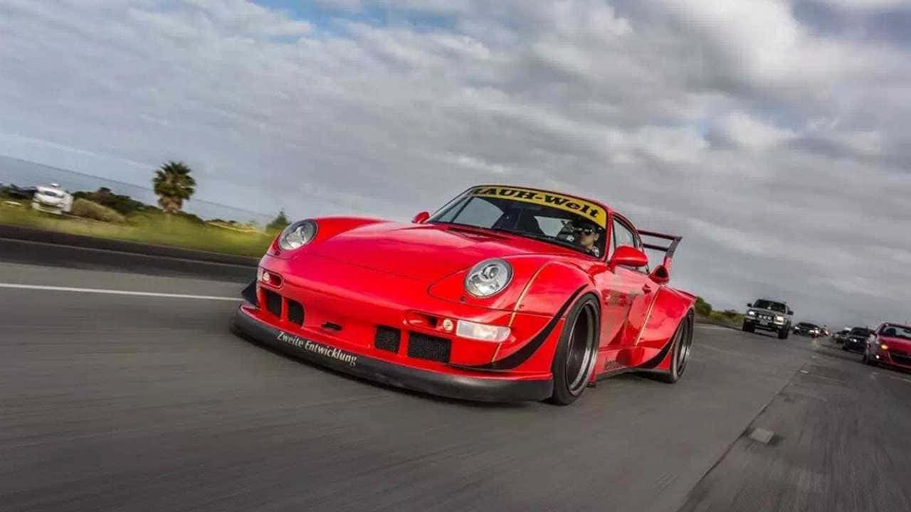 Majestic Porsche 993 Under Clear Blue Sky Wallpaper