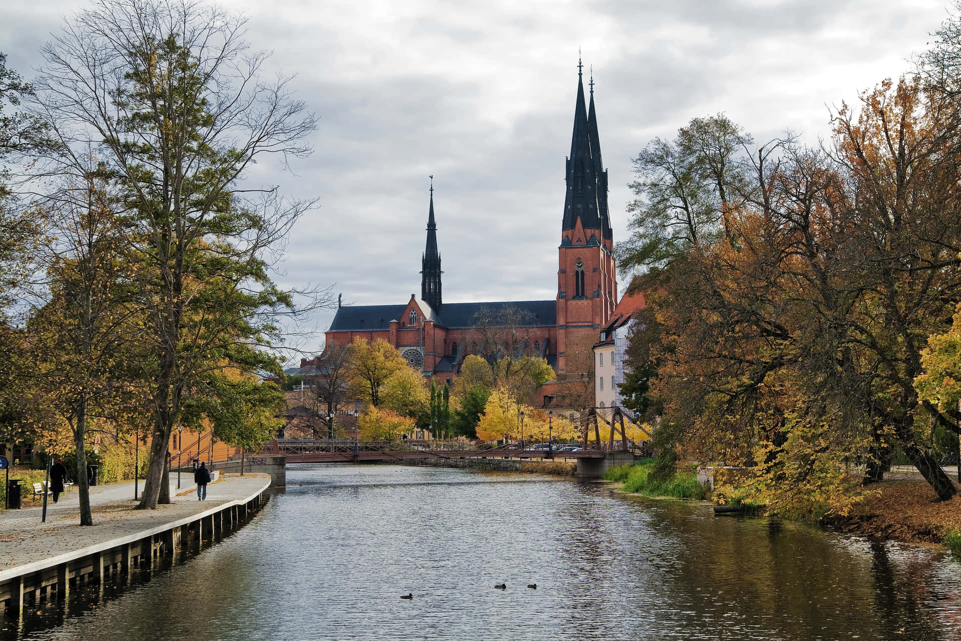 Majestic Sunset Overlooking The Serene Landscape Of Uppsala, Sweden Wallpaper