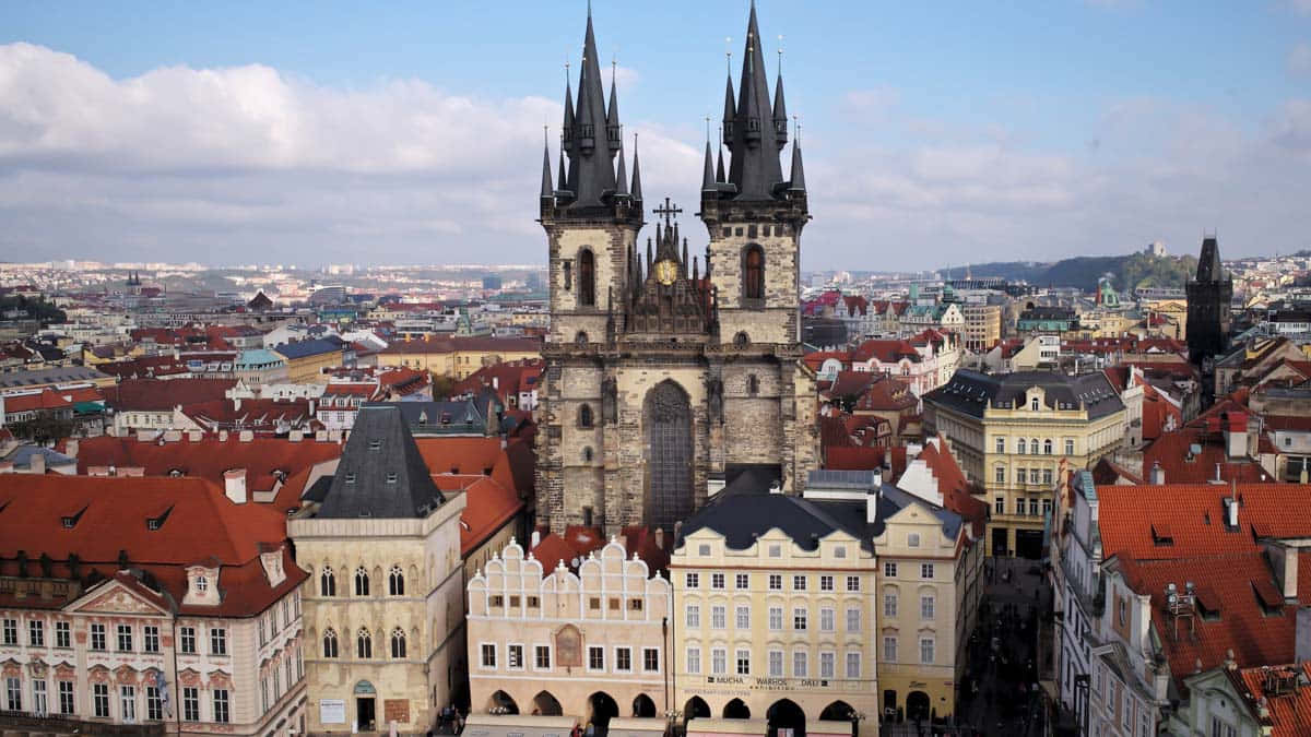 Majestic Tyn Church Towering Over Prague Wallpaper