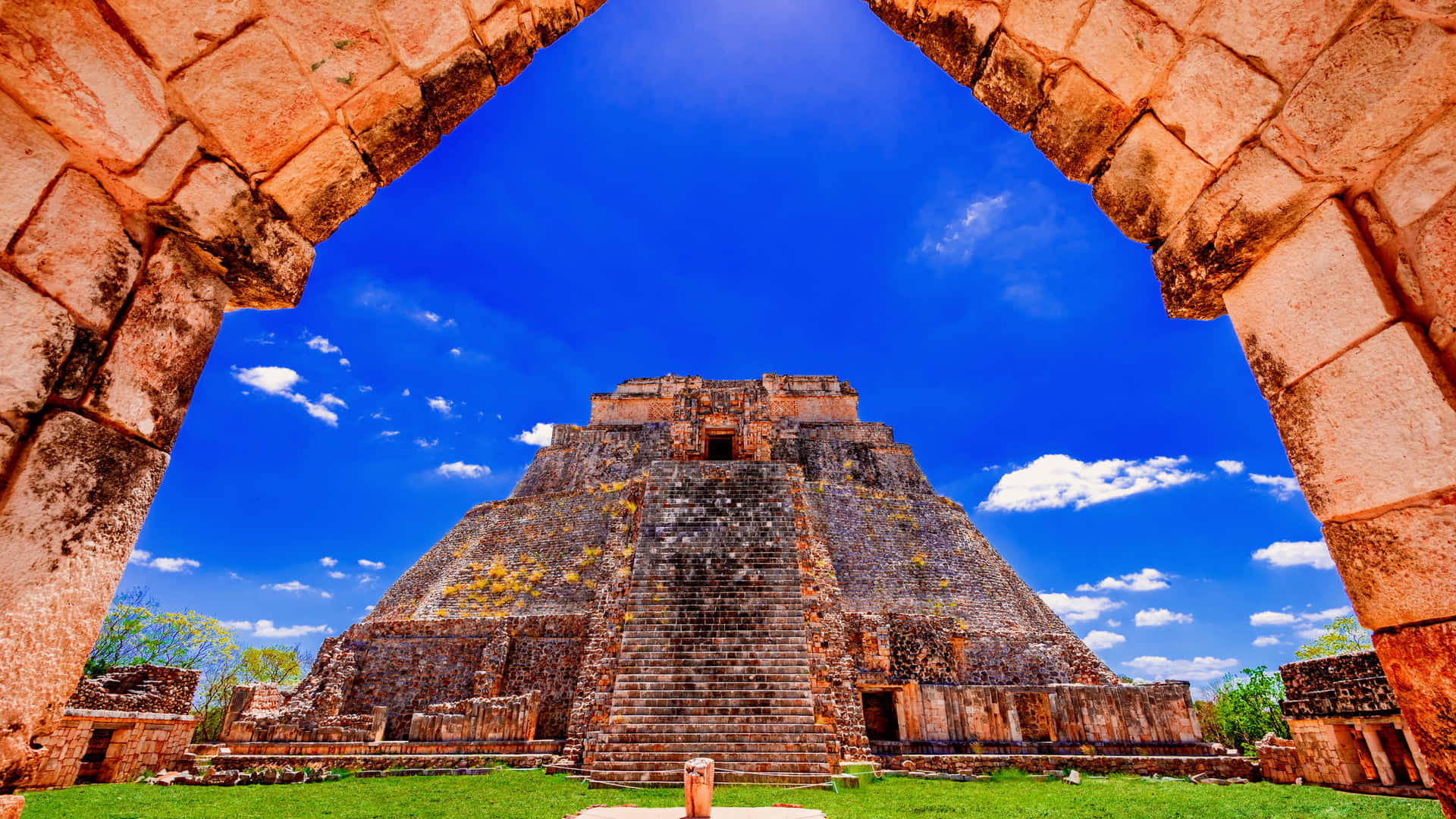 Majestic Uxmal Mayan Ruins Against A Stunning Sunset Wallpaper