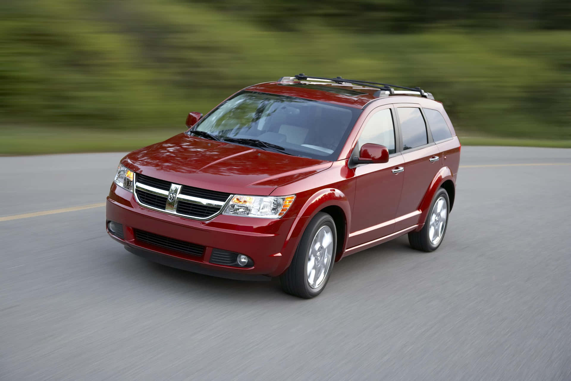 Majestic View Of A Dodge Journey On Open Road Wallpaper
