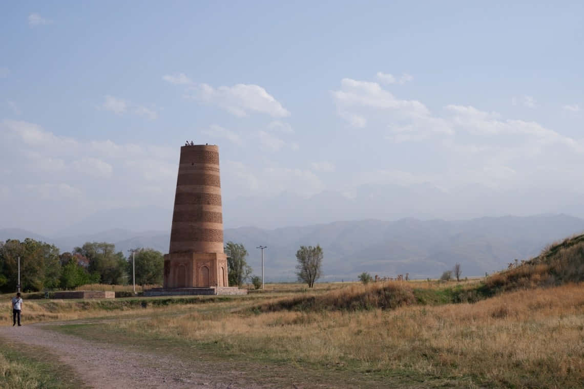 Majestic View Of Burana Tower Against Blue Sky Wallpaper