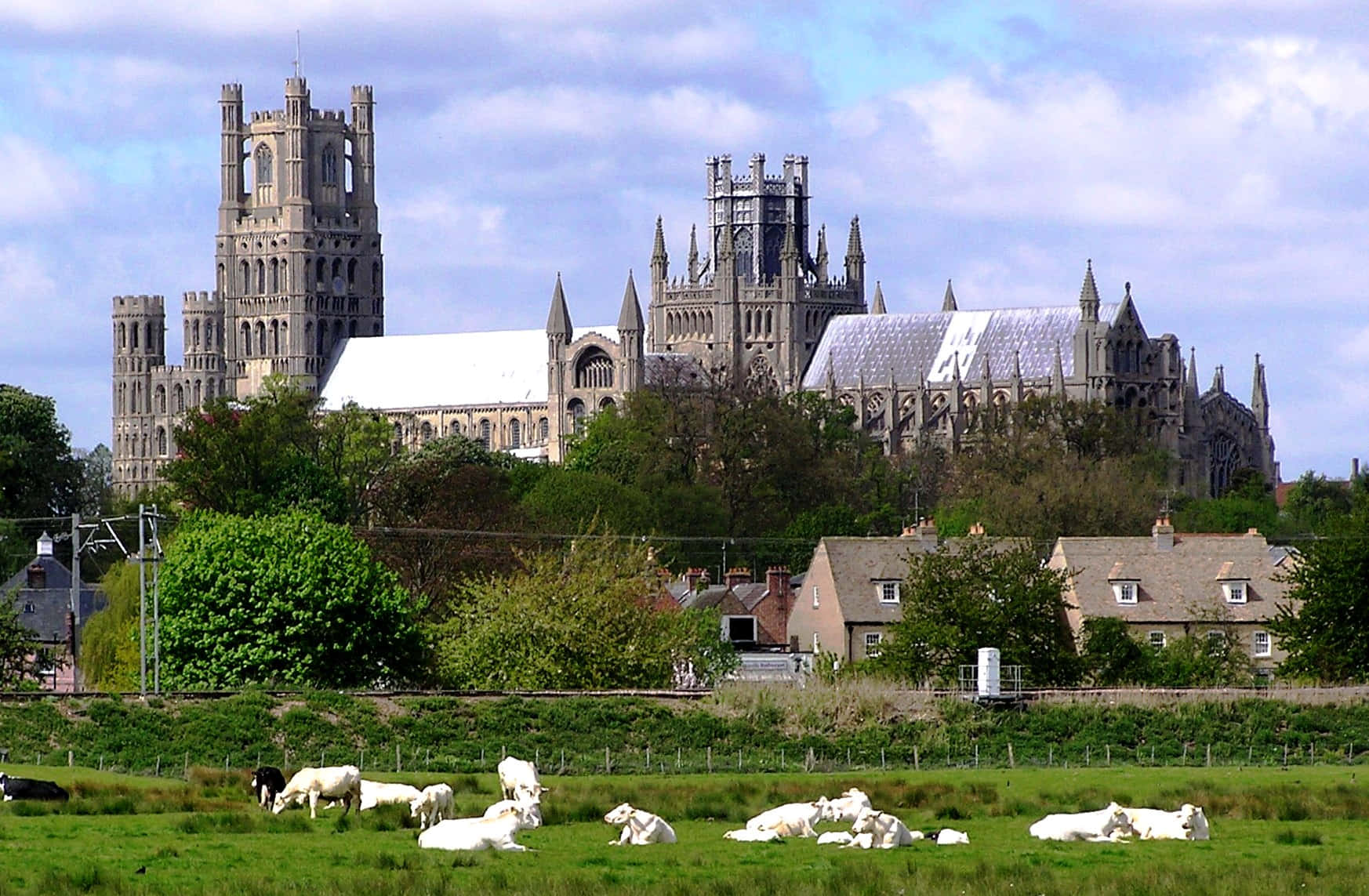 Majestic View Of Ely Cathedral Dominating The Skyline Of Ely, United Kingdom Wallpaper