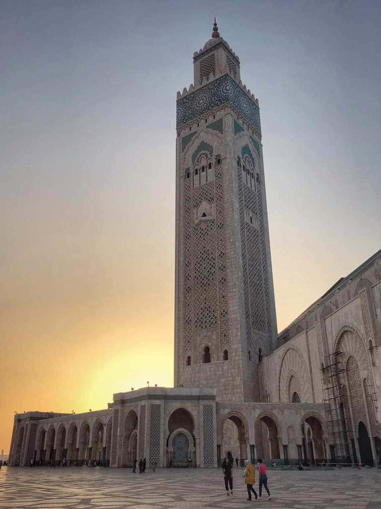 Majestic View Of Hassan Ii Mosque At Dusk Wallpaper