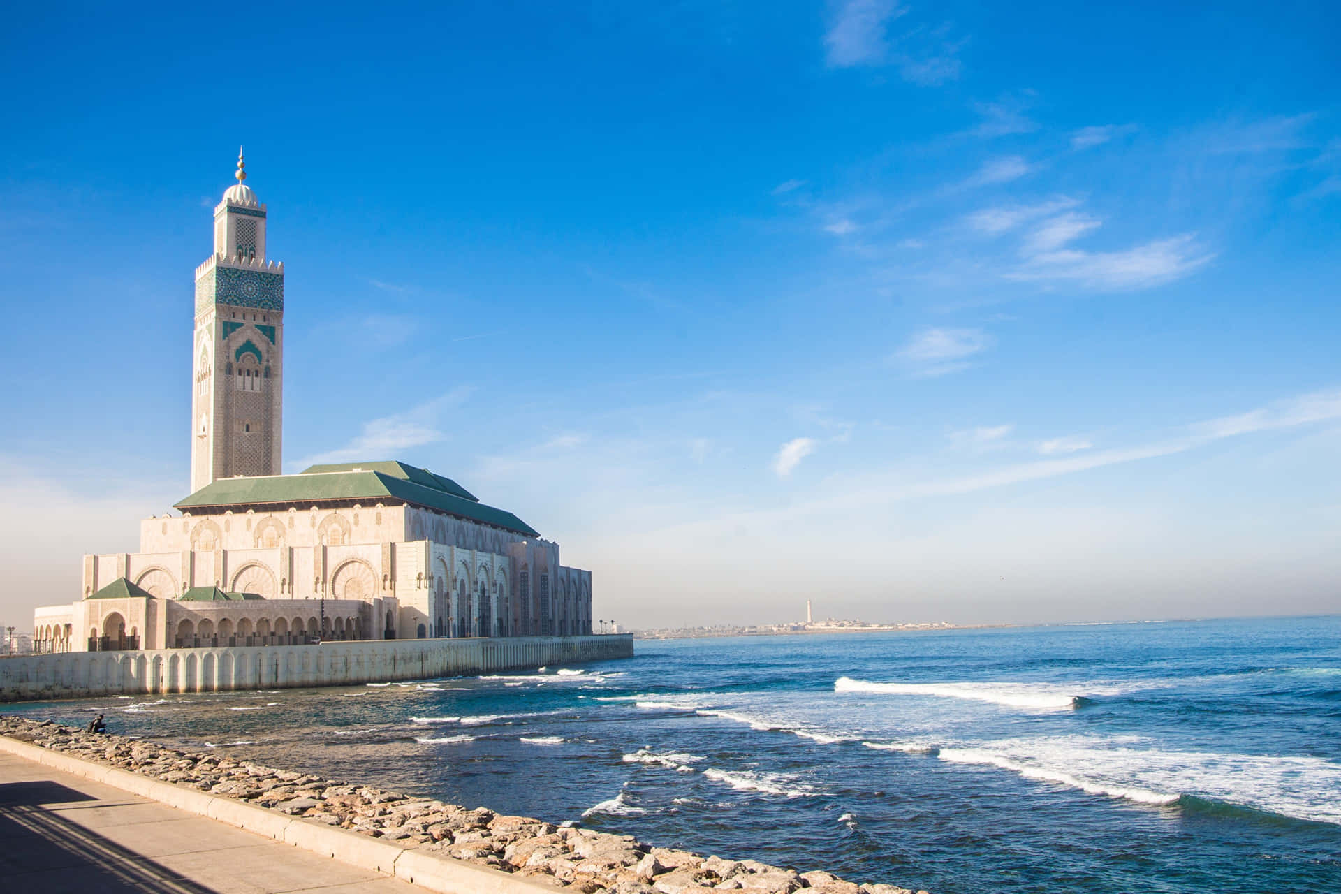 Majestic View Of Hassan Ii Mosque At Sunset Wallpaper
