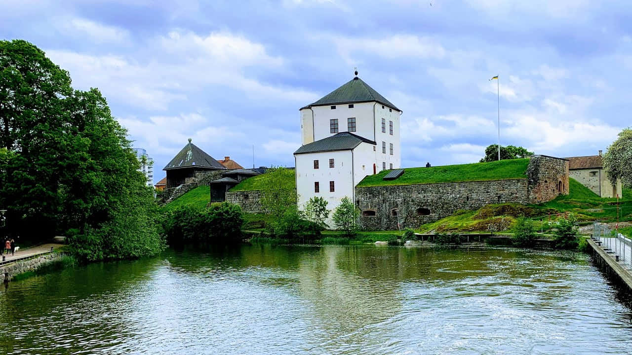 Majestic View Of Nyköping Waterfront In A Serene Evening Wallpaper