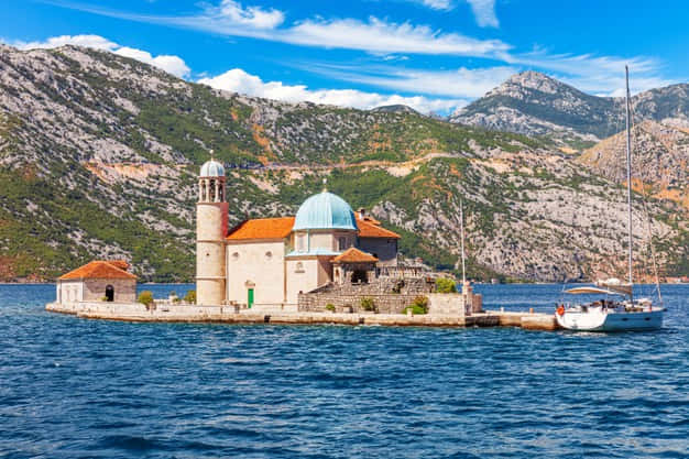 Majestic View Of Our Lady Of The Rocks Church In Montenegro Wallpaper