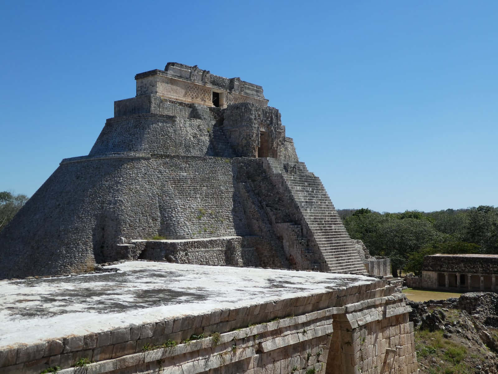 Majestic View Of The Ancient Uxmal Ruins In Mexico Wallpaper