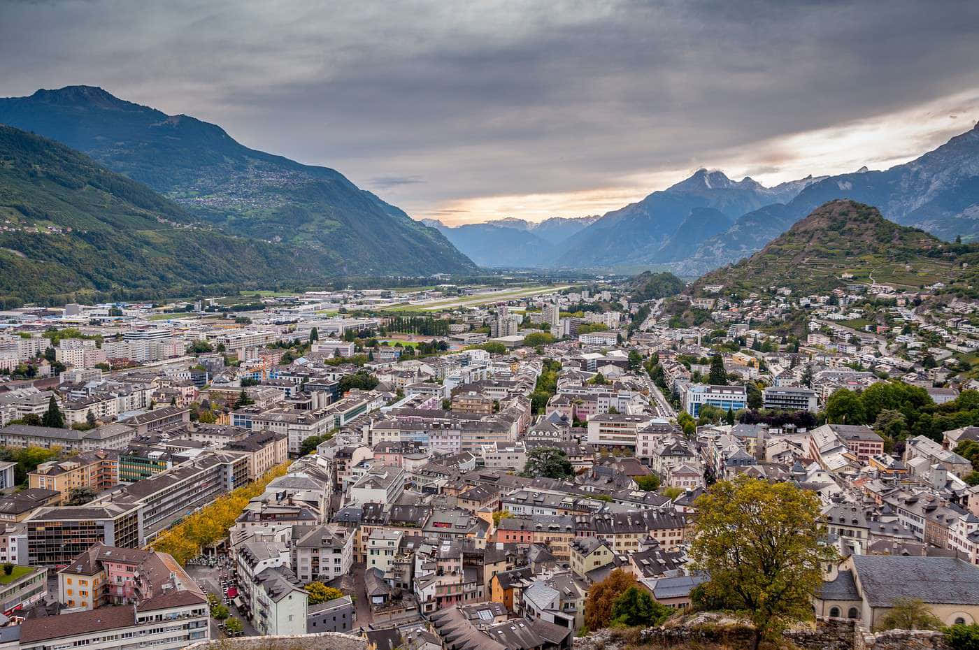 Majestic View Of The Historic Town Of Sion Nestled In The Swiss Alps. Wallpaper