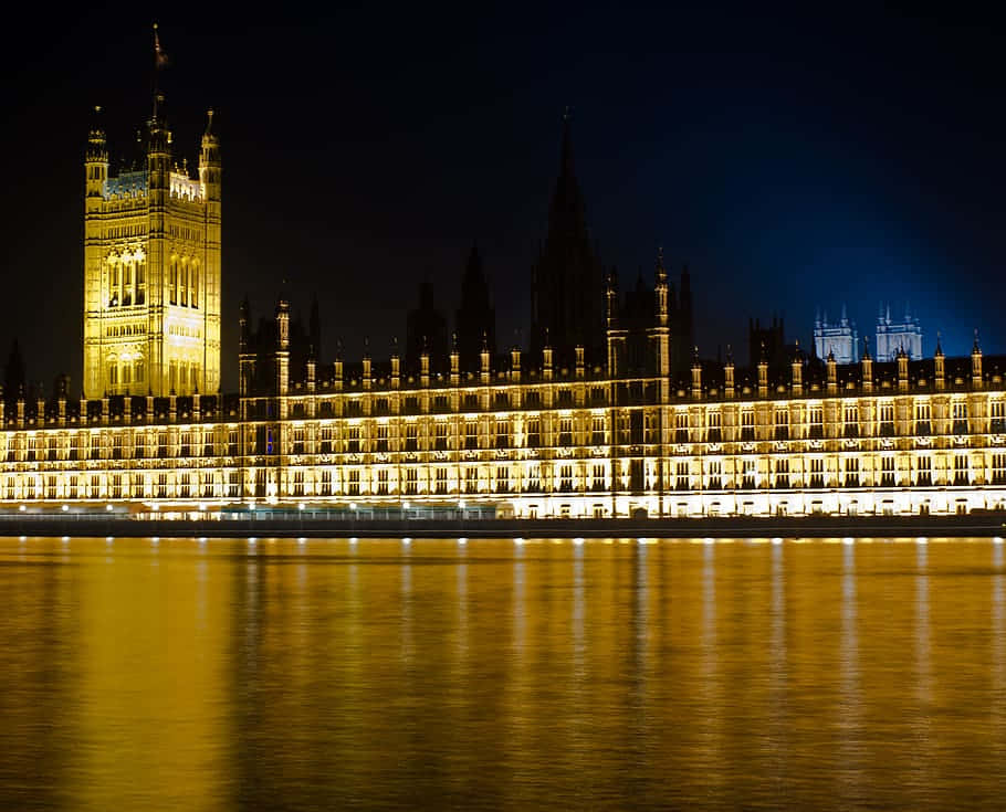Majestic View Of The House Of Parliament At Sunset Wallpaper