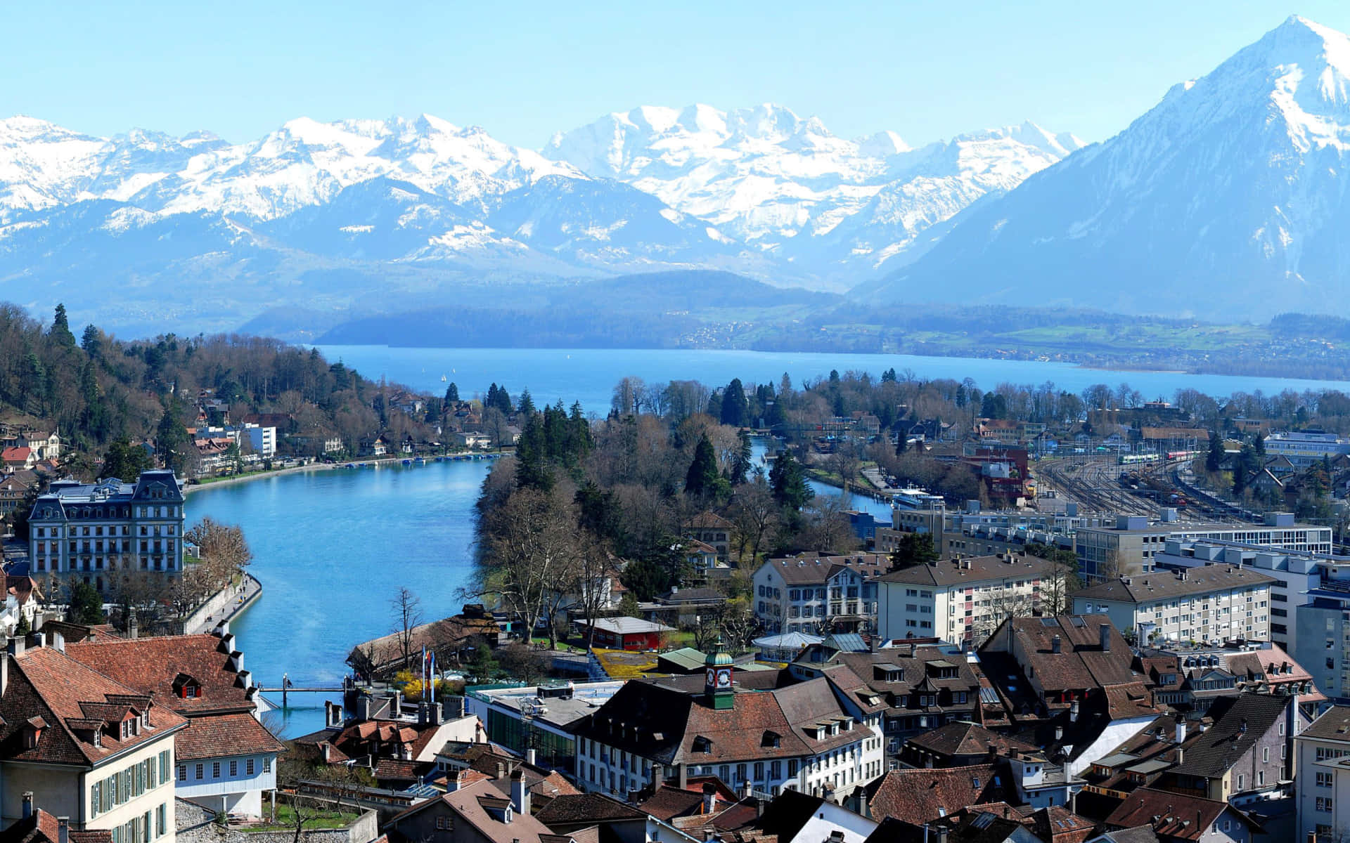 Majestic Views Of Thun, A Captivating Swiss Town By The Waterfront Wallpaper