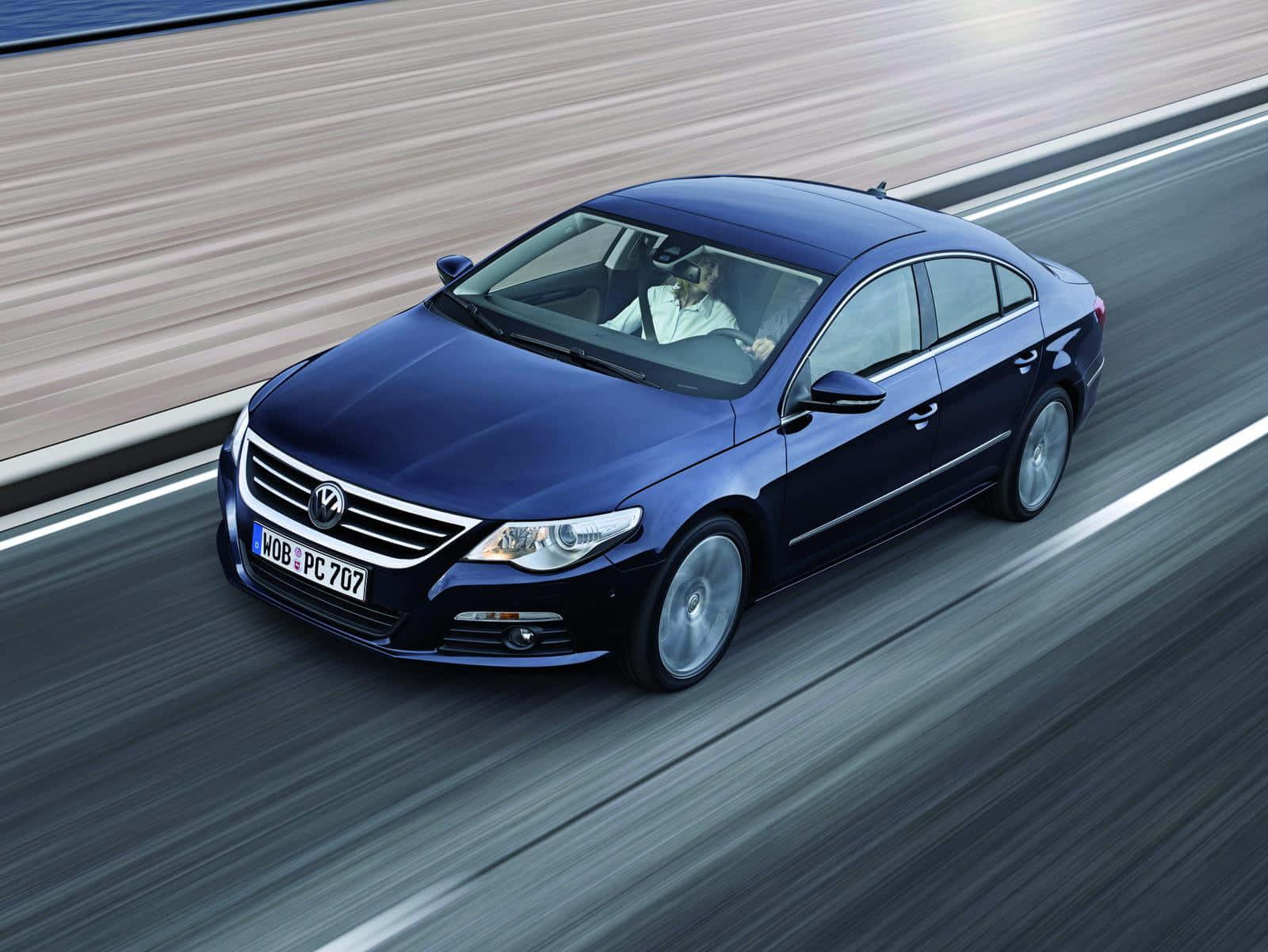 Volkswagen Passat Cc Yang Megah Meluncur Di Jalan Terbuka Wallpaper