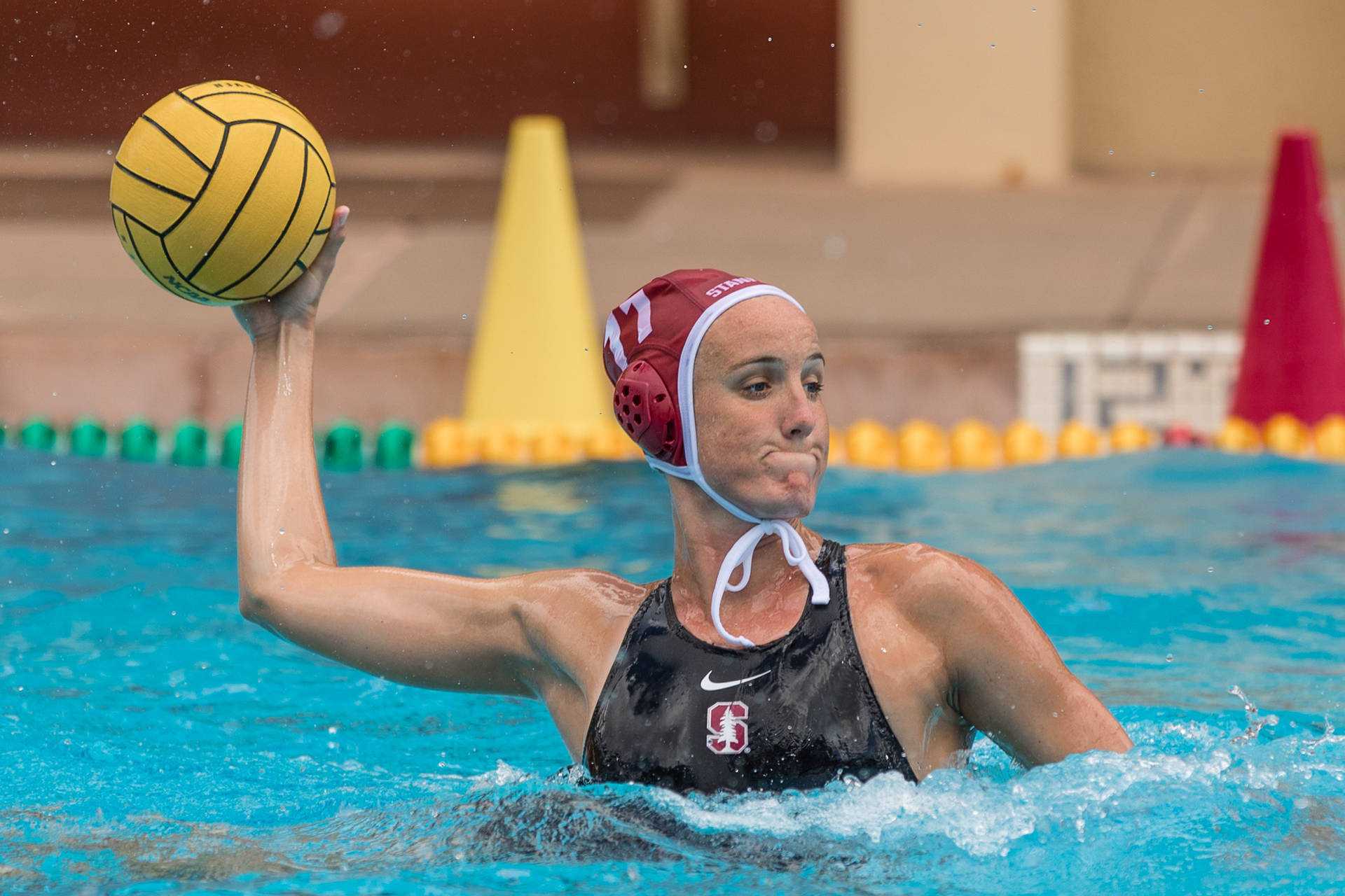 Makenzie Fischer in action during a water polo match Wallpaper