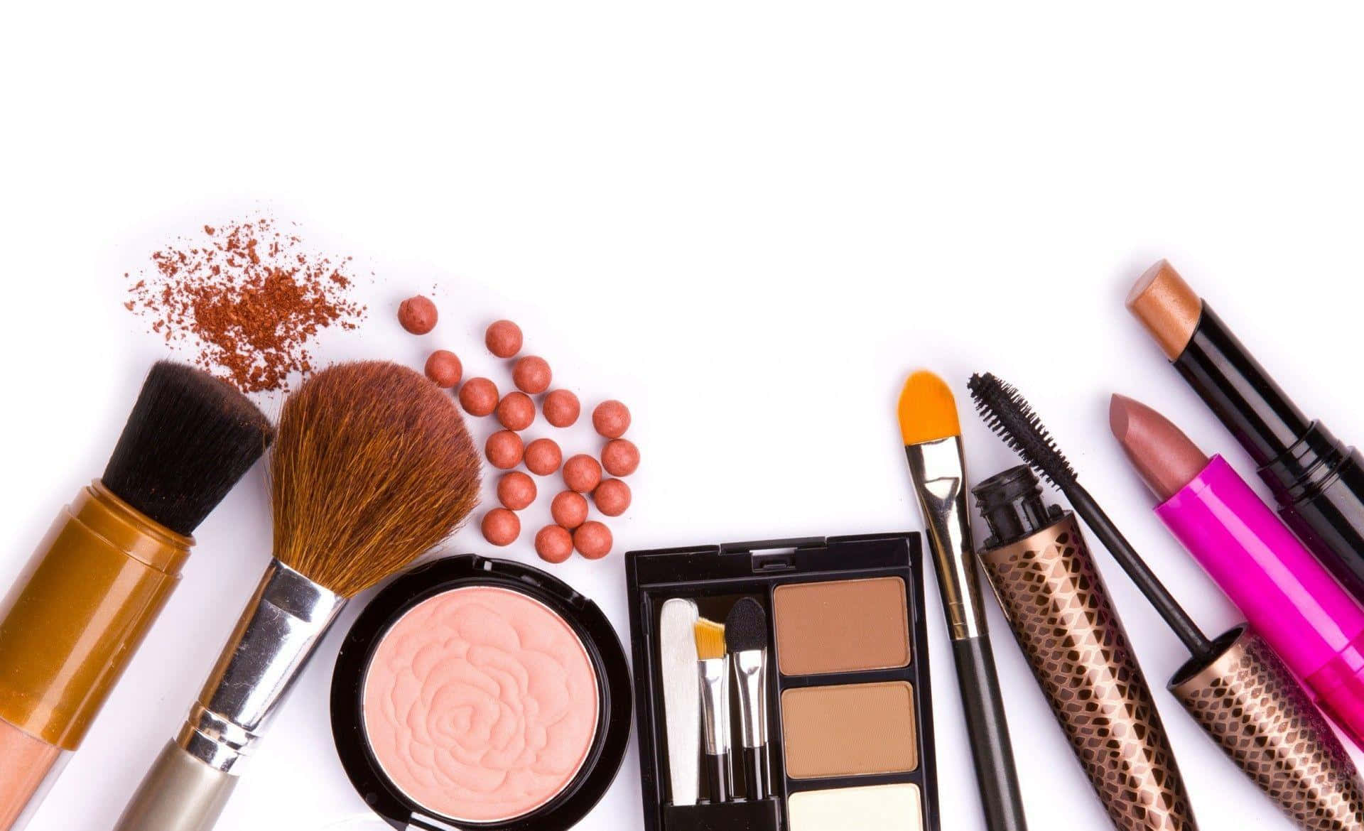 cosmetics and makeup brushes on a white background