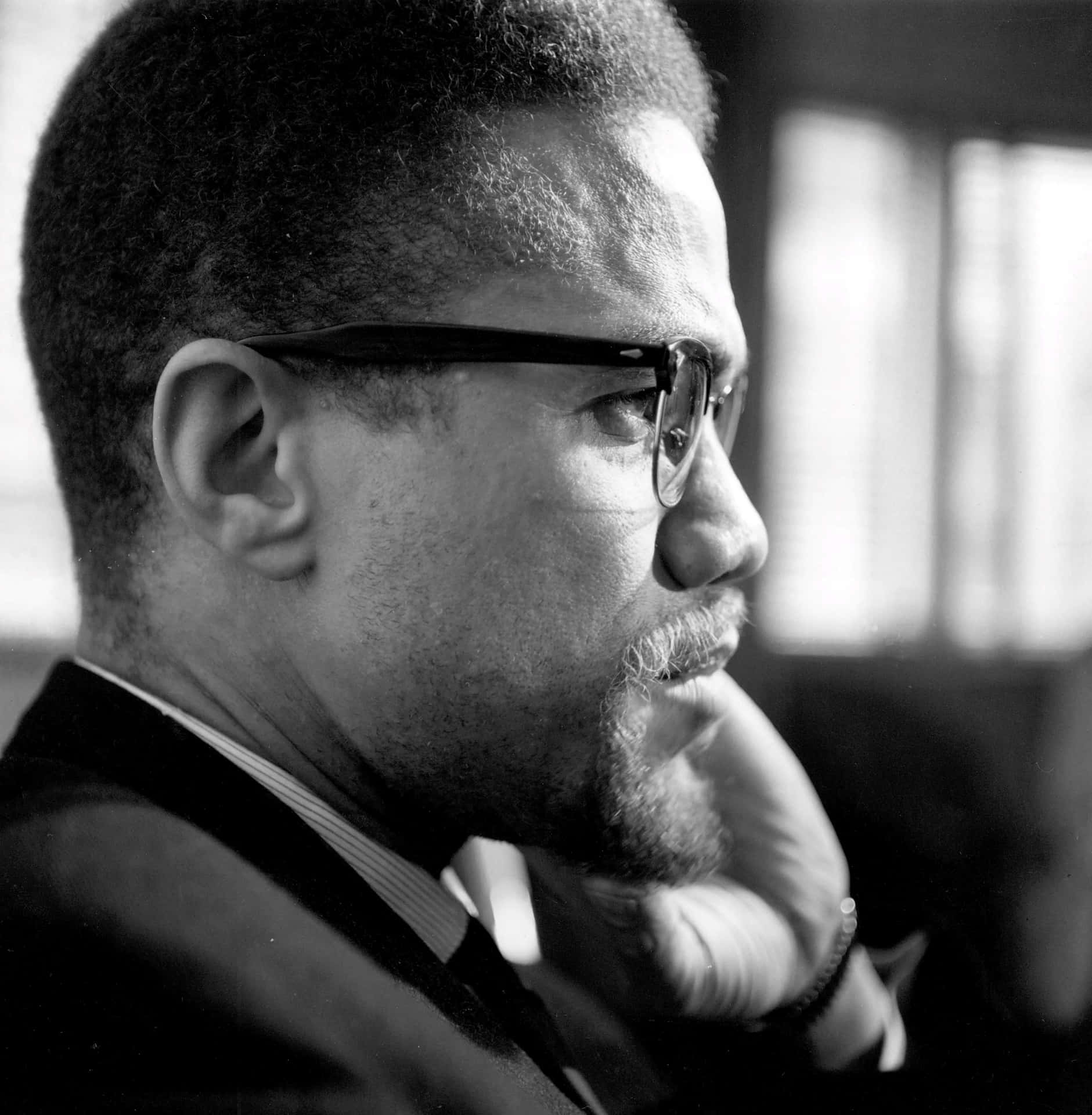 Malcolm X Contemplative Portrait Wallpaper