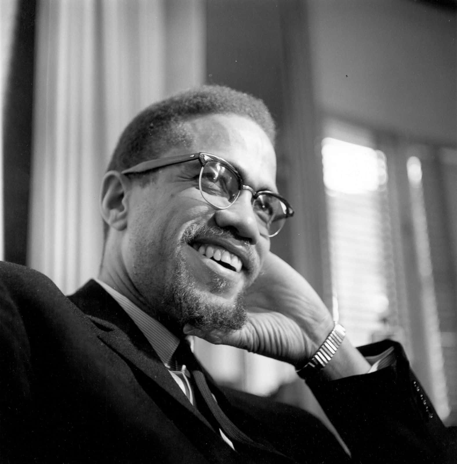 Malcolm X Smiling Portrait Wallpaper