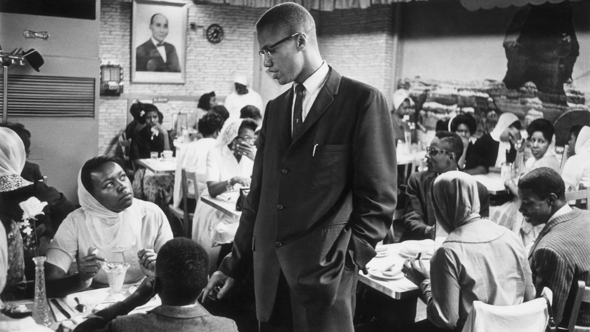 Malcolm X Speakingata Community Gathering Wallpaper