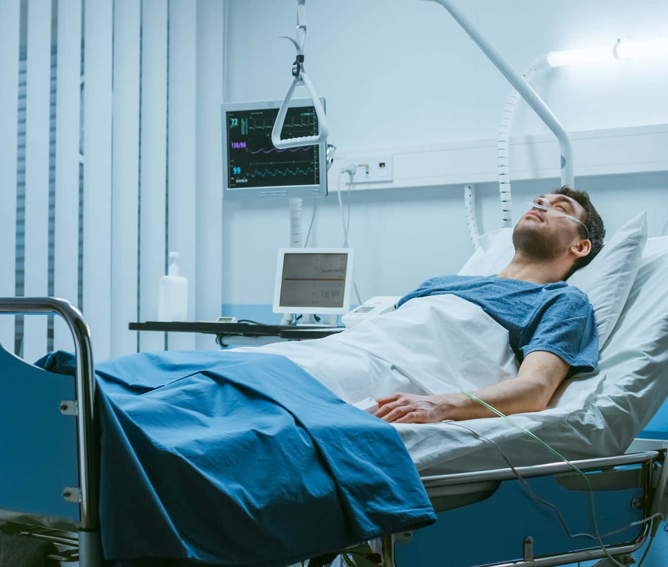 Peaceful male patient resting on hospital bed Wallpaper