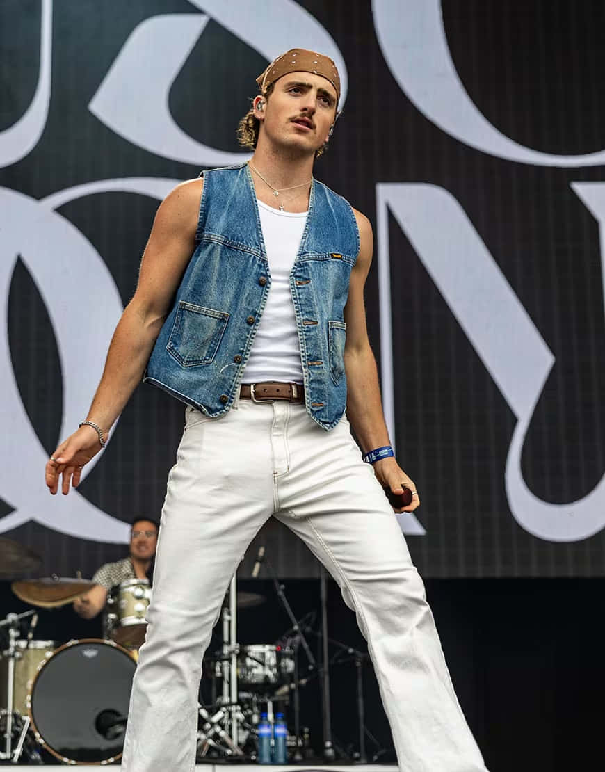 Male Performer On Stage Denim Vest Wallpaper