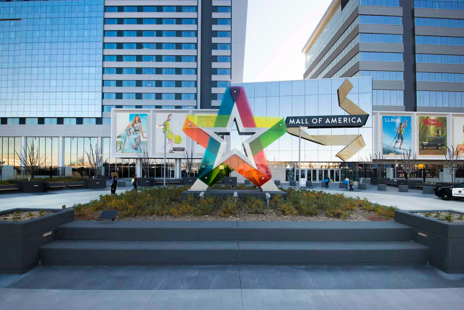 A Large Star Shaped Sculpture Is In Front Of A Building