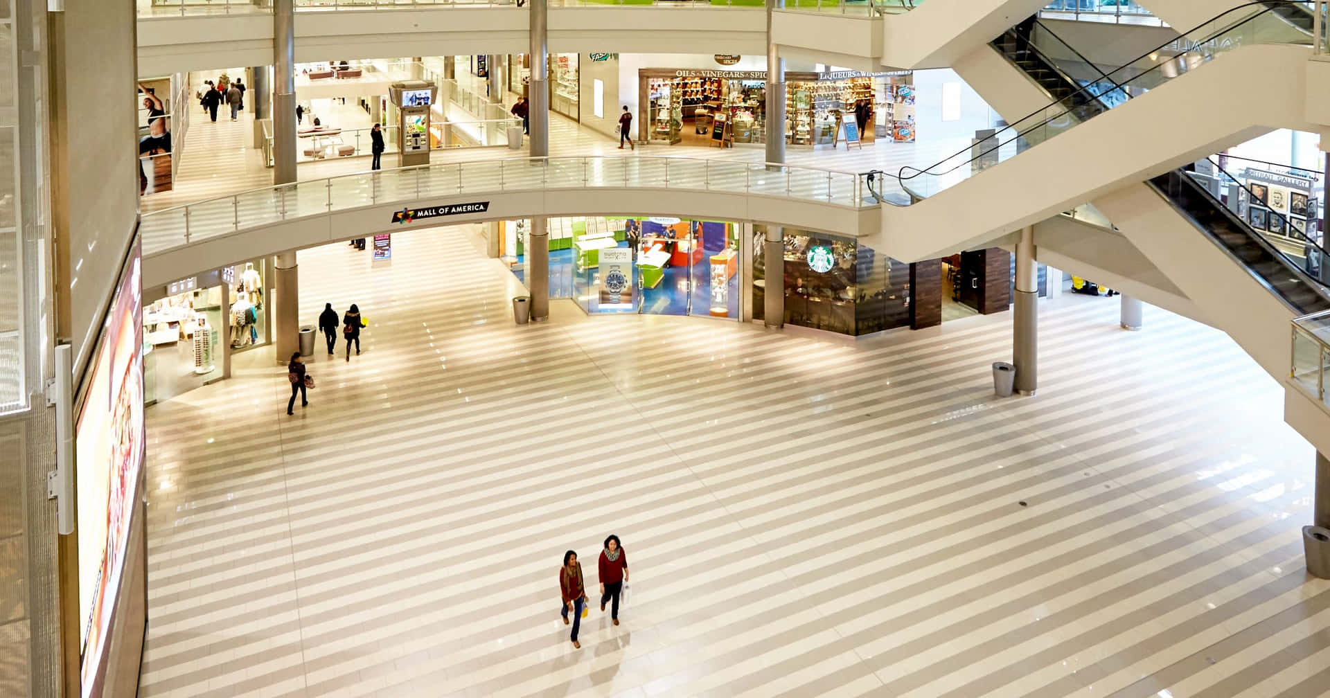 A Large Mall With People Walking Around