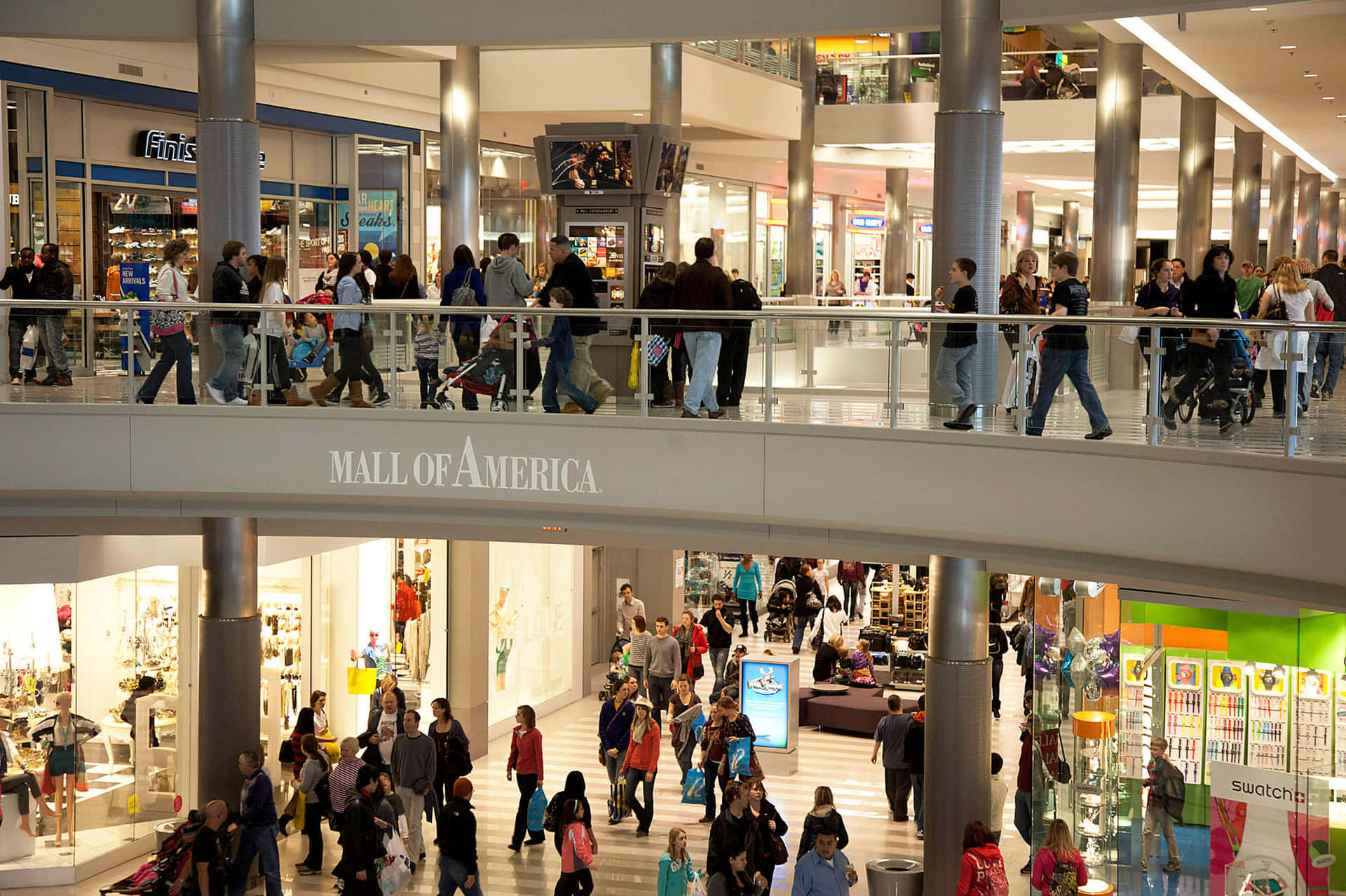 A Mall With Many People Walking Around