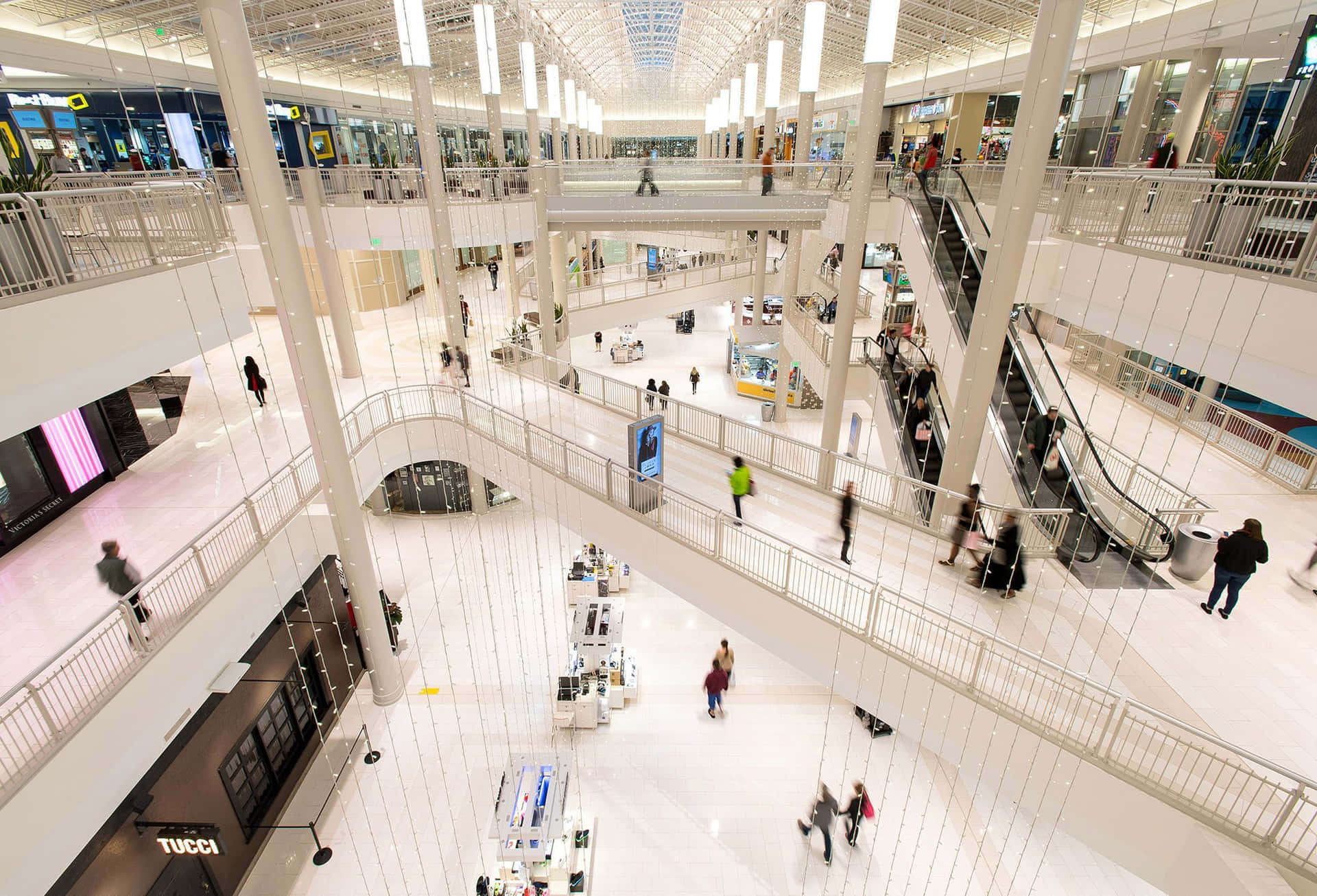 A Large Mall With People Walking Around