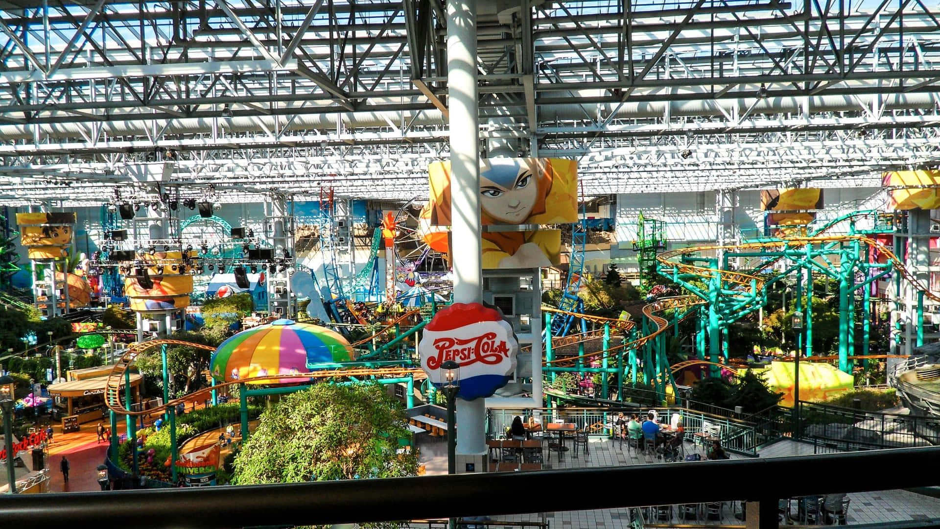 A Large Indoor Amusement Park With A Lot Of Rides