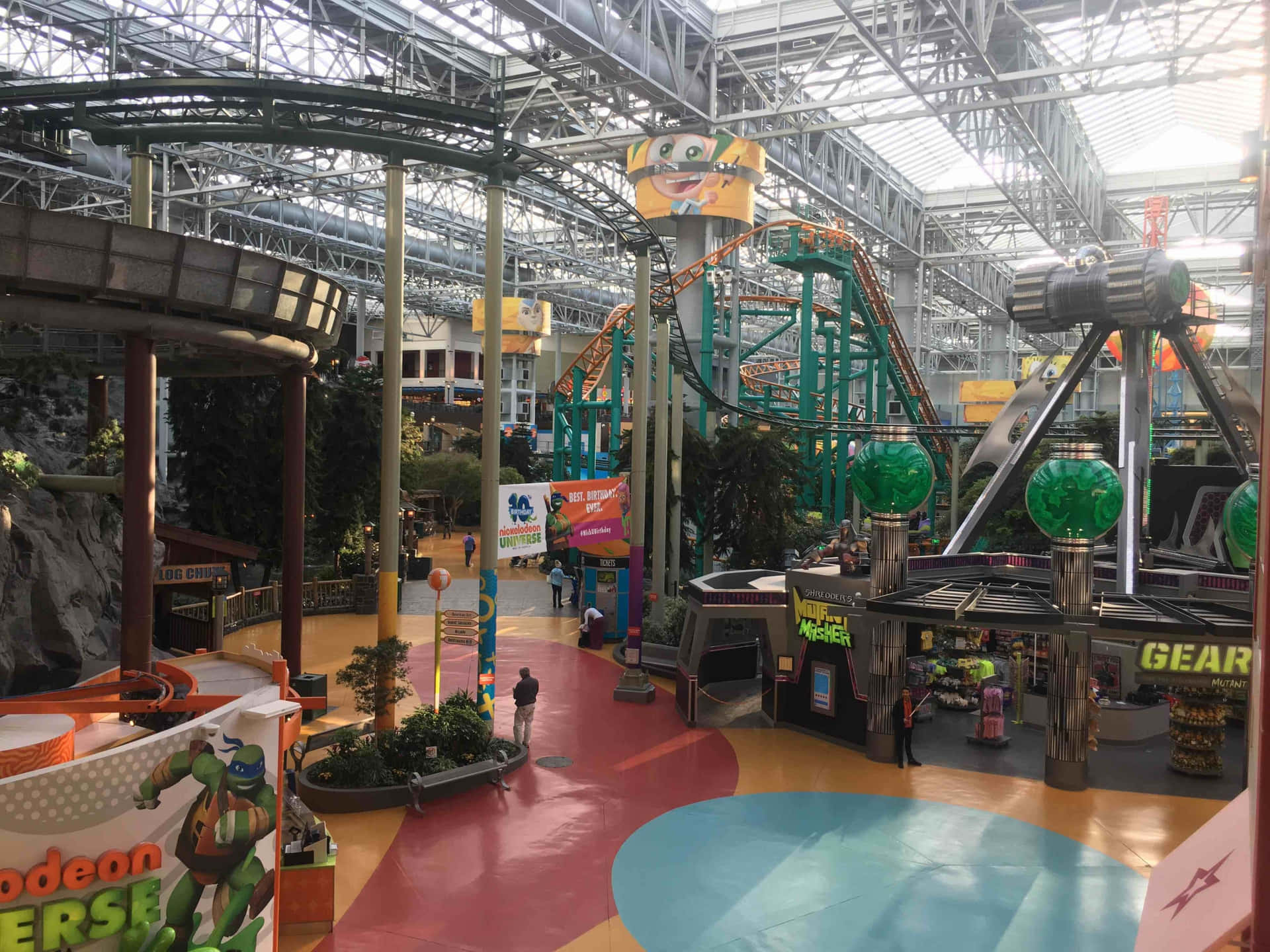 A Large Indoor Amusement Park With Many Rides And Attractions