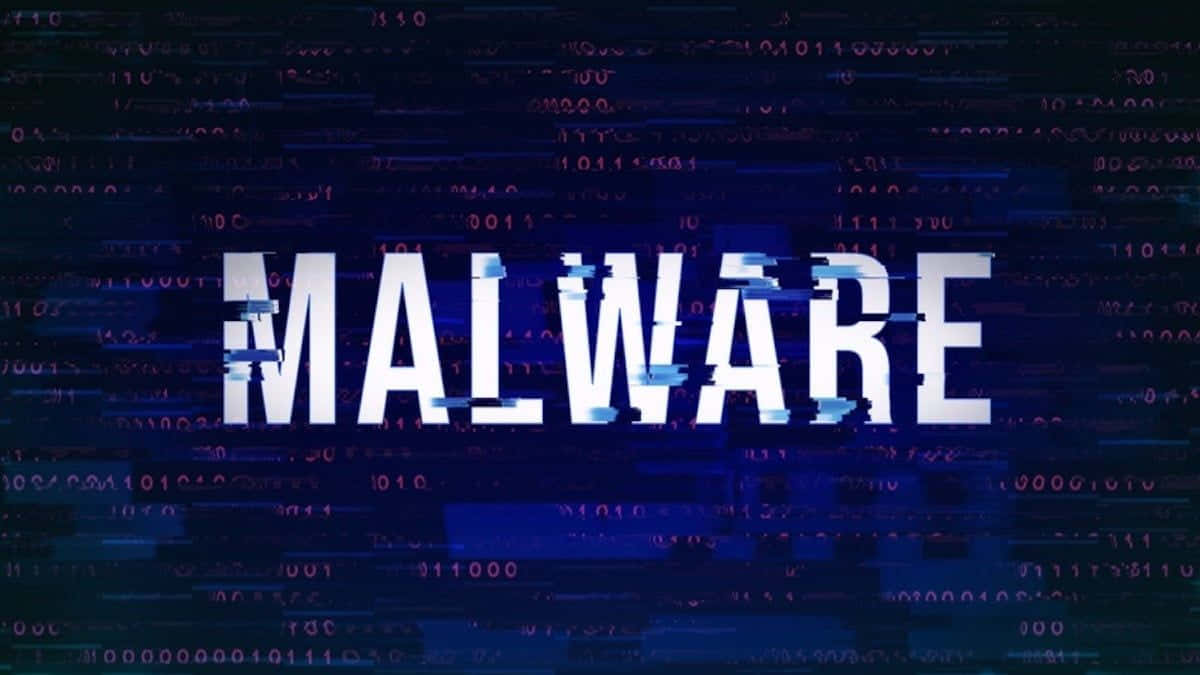Ordet malware vises på en mørk baggrund Wallpaper