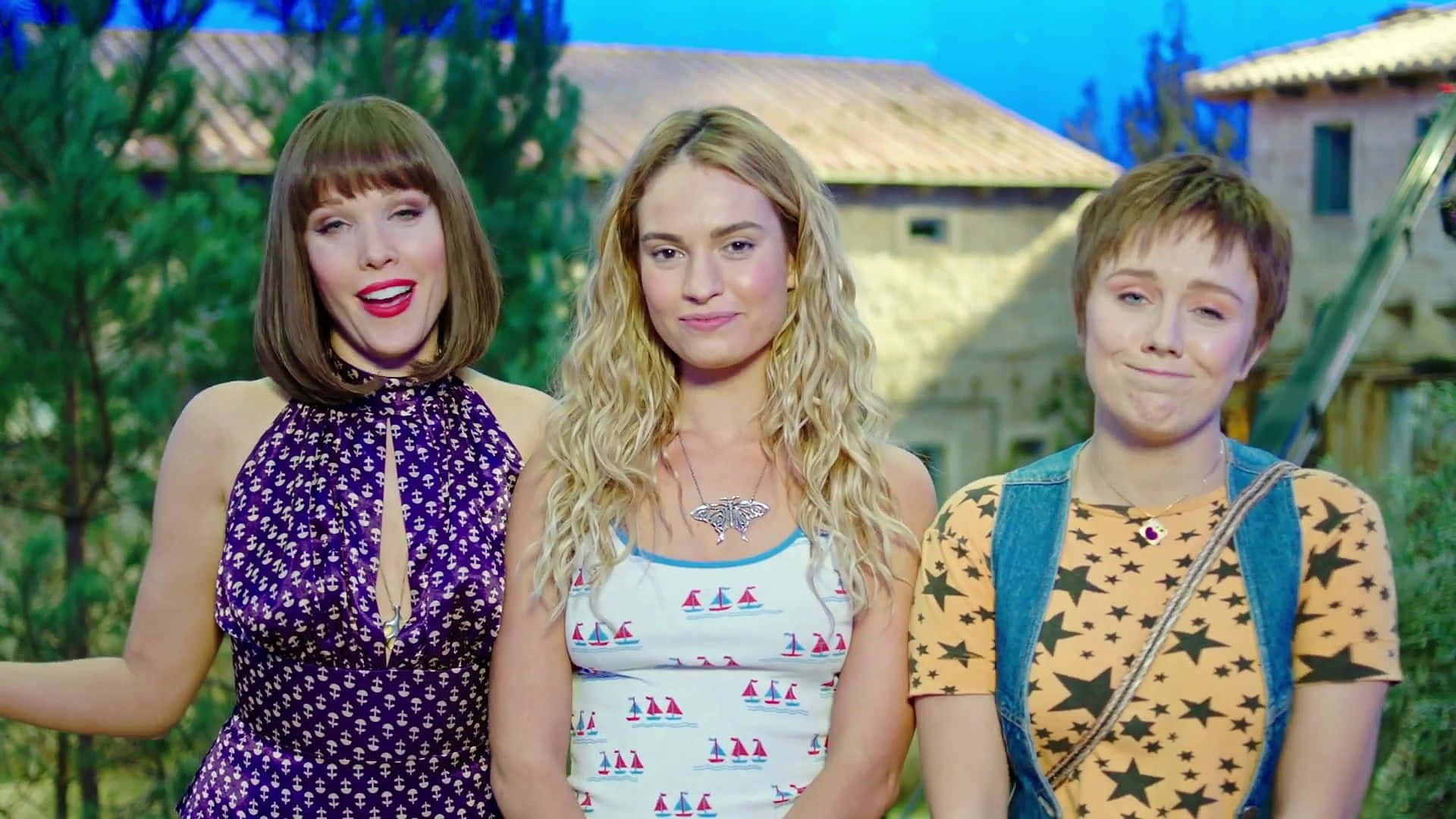 Three Girls Are Standing Next To Each Other On A Television Show