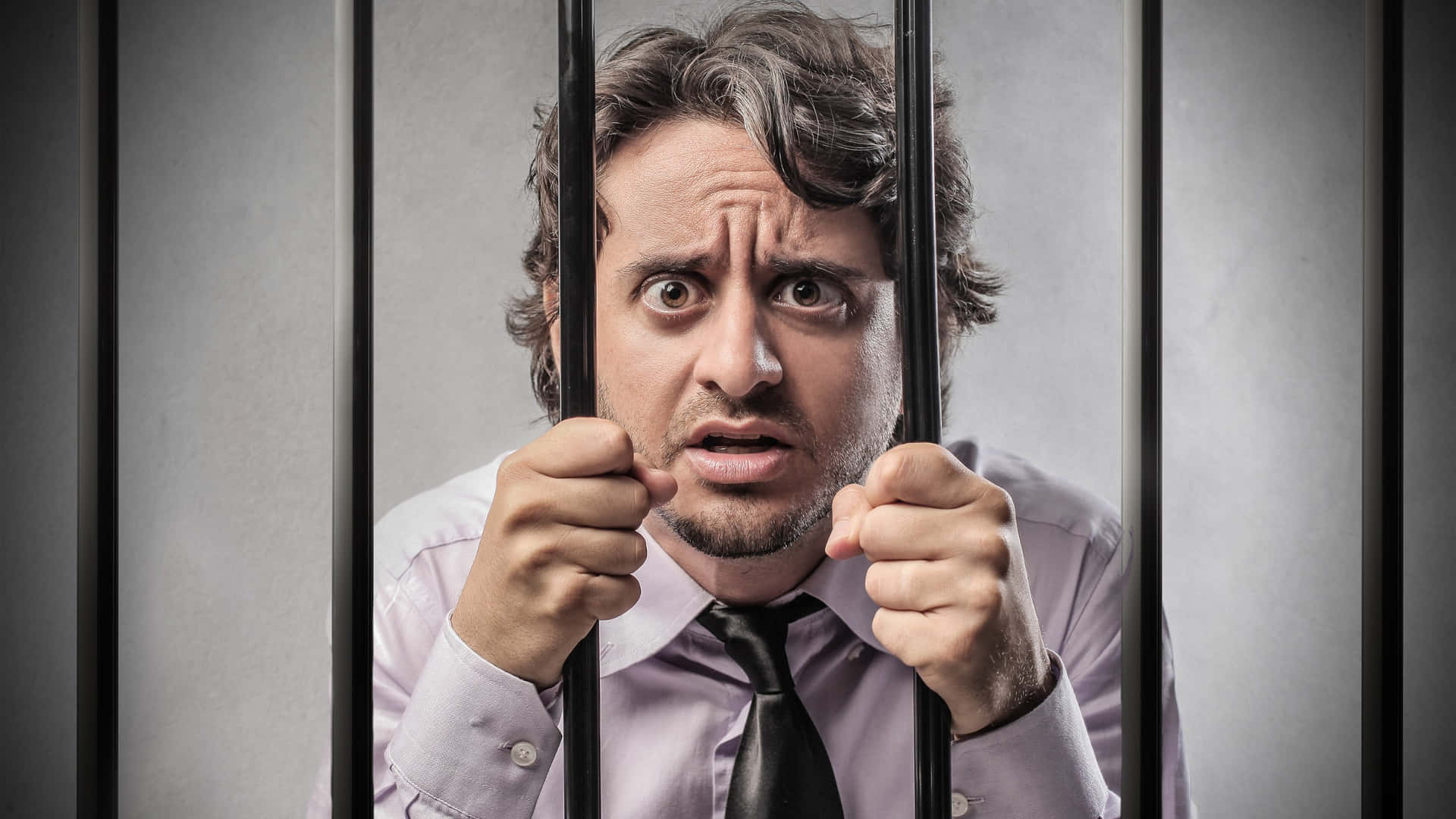 Man Behind Bars Expression Wallpaper