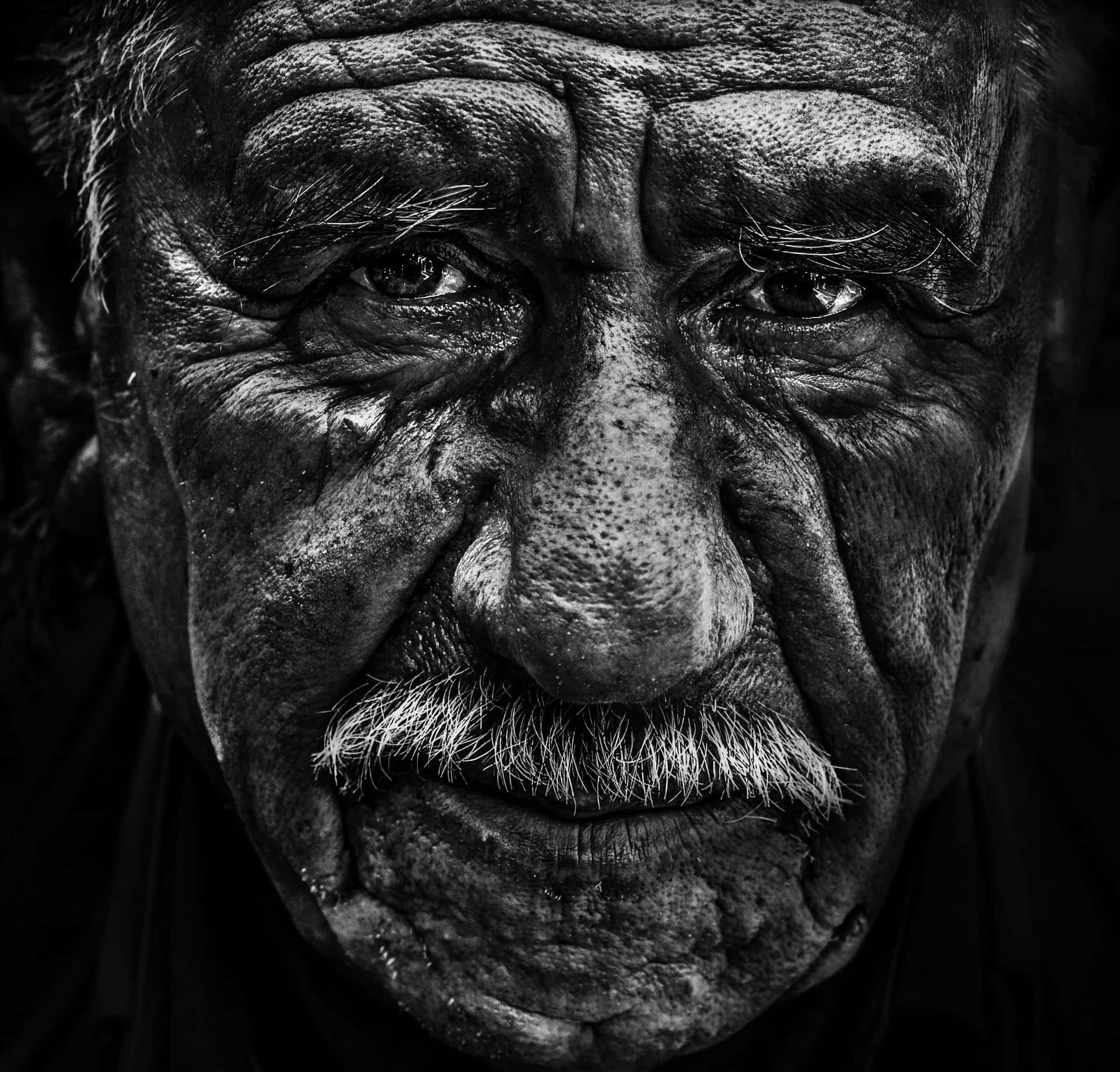 Portrait of an Elderly Man with Rugged Features Wallpaper