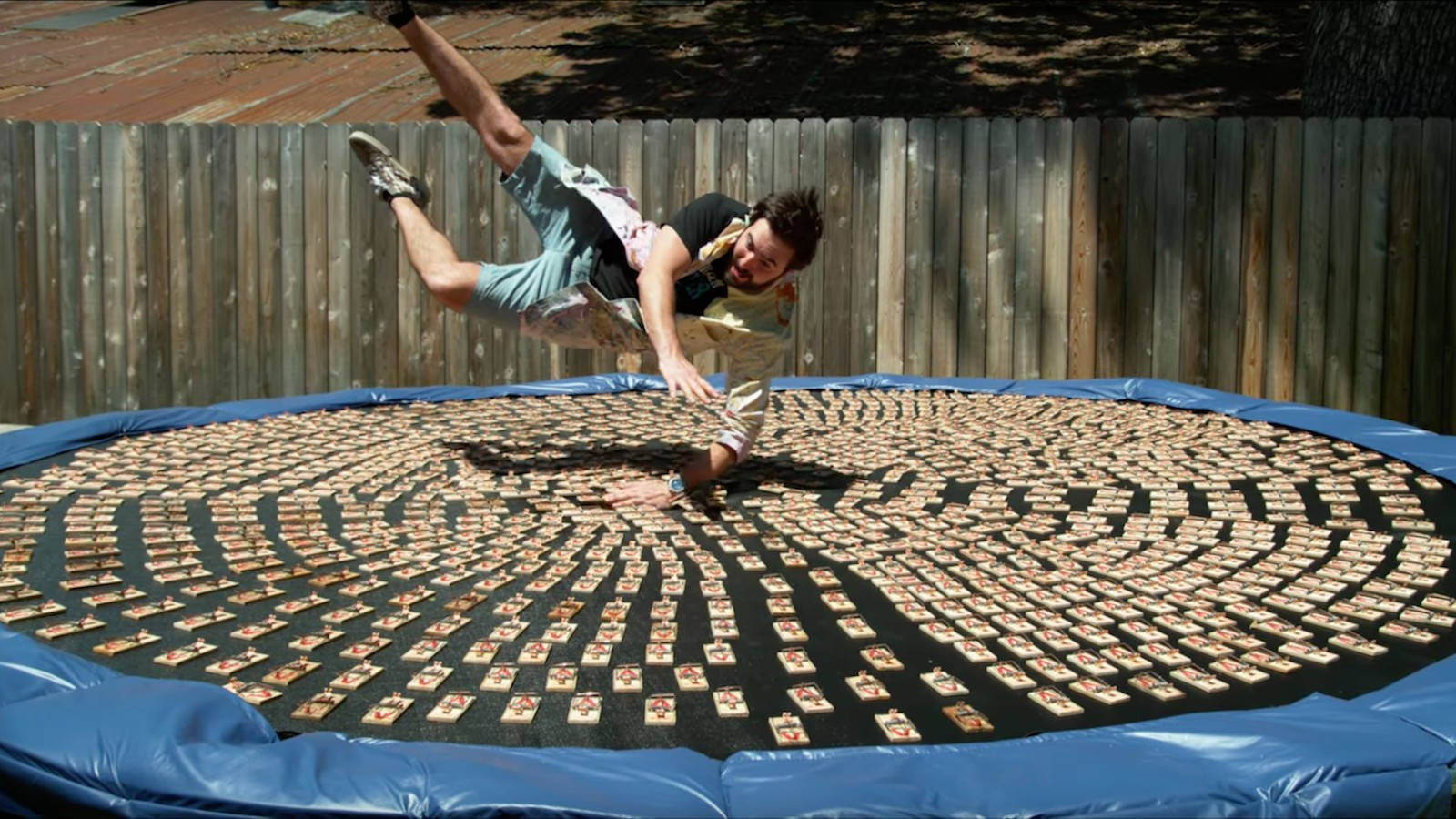 Man Landing On A Huge Trampoline Wallpaper
