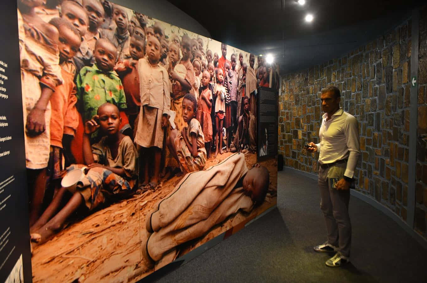 Man Looking At Kigali Genocide Memorial Pictures Wallpaper