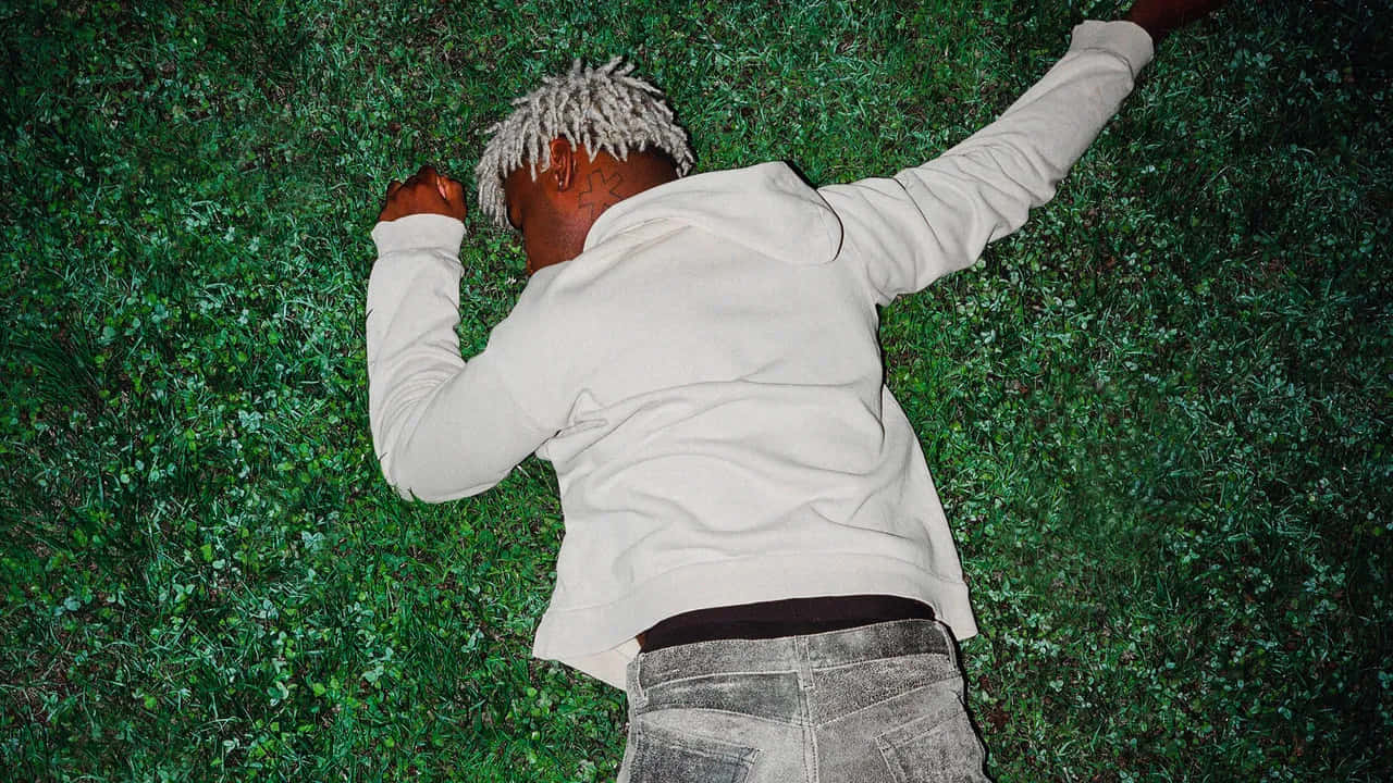 Man Lyingon Grass Wallpaper