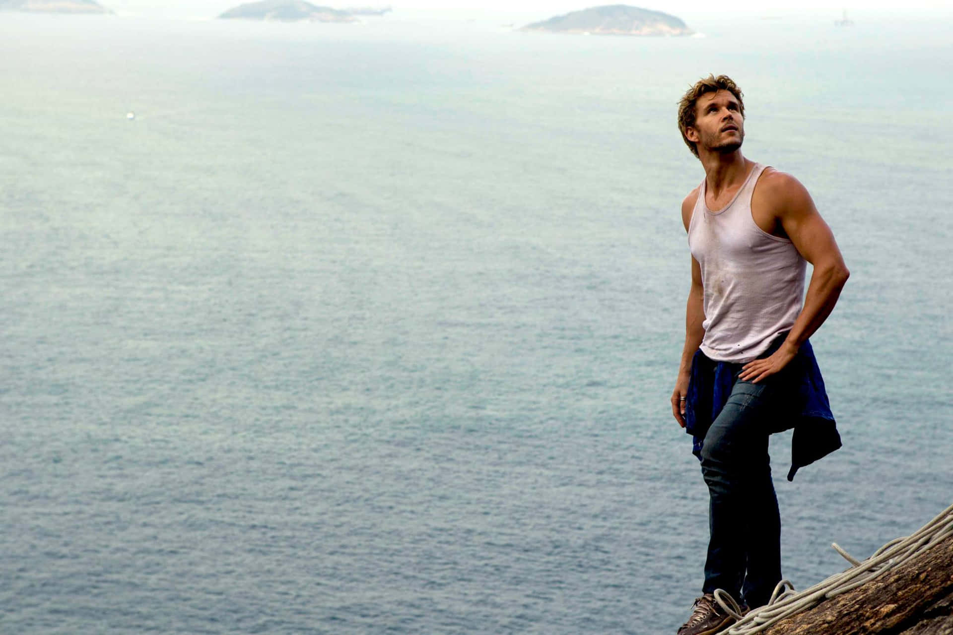 Man Overlooking Ocean Cliff Wallpaper