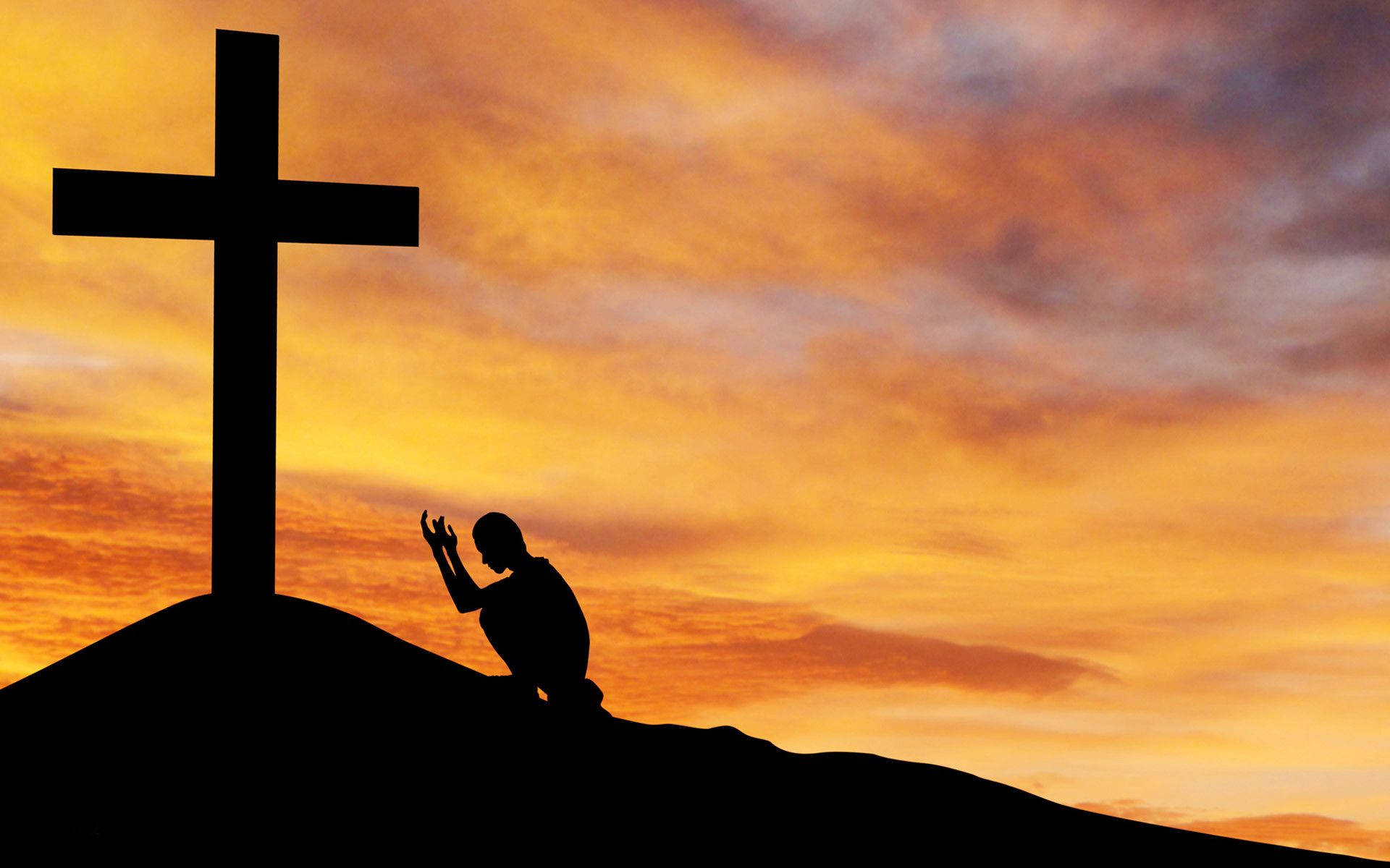 Man Praying To Cross Of The Christian God Background