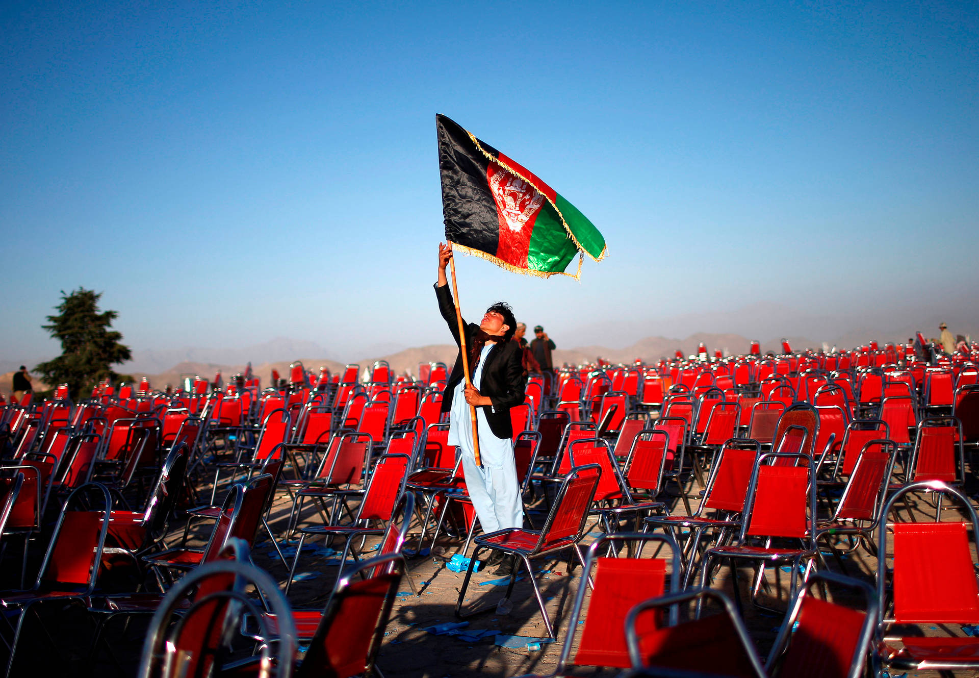 Man Raising Afghanistan Flag
