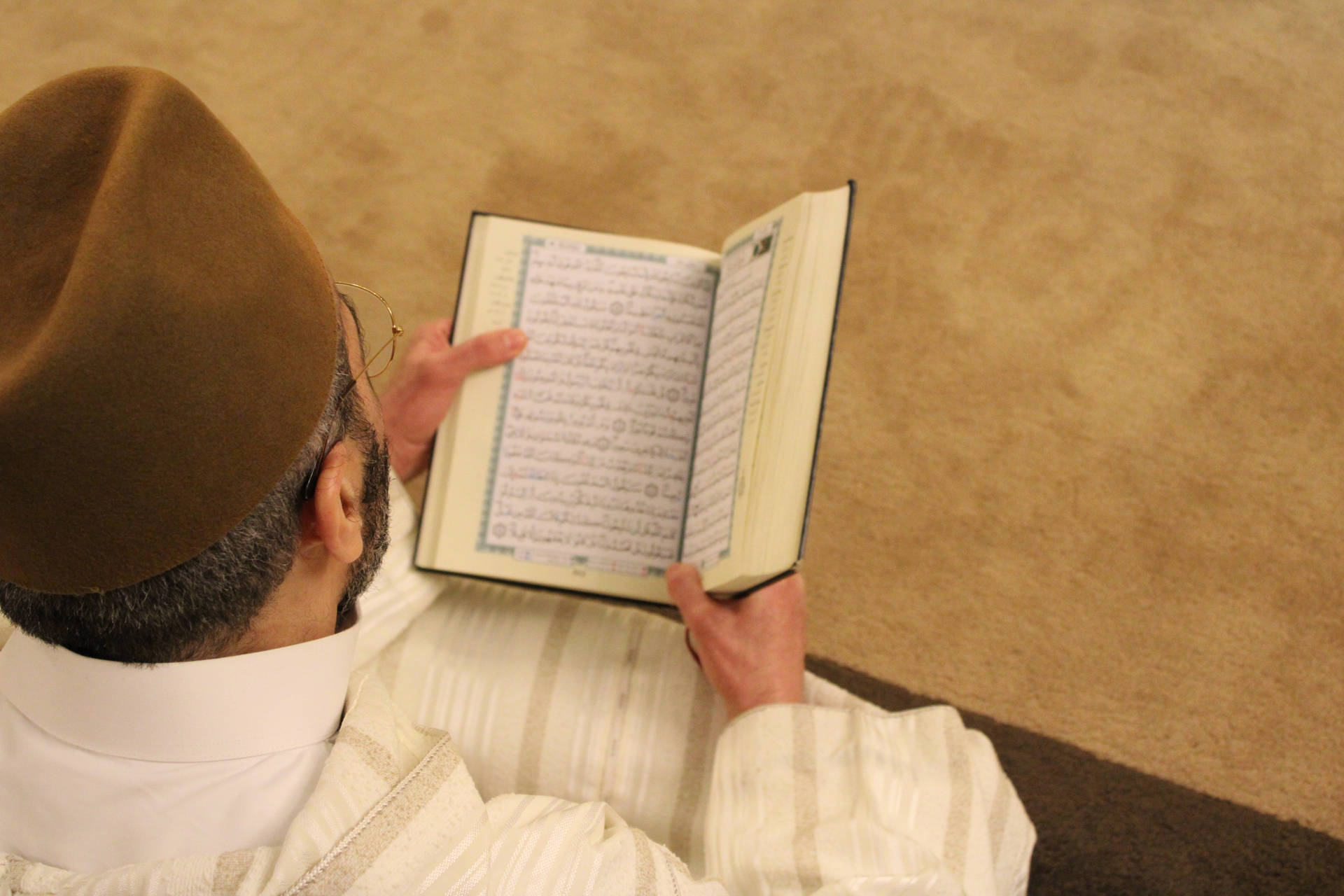 Man Reading Words Of Allah