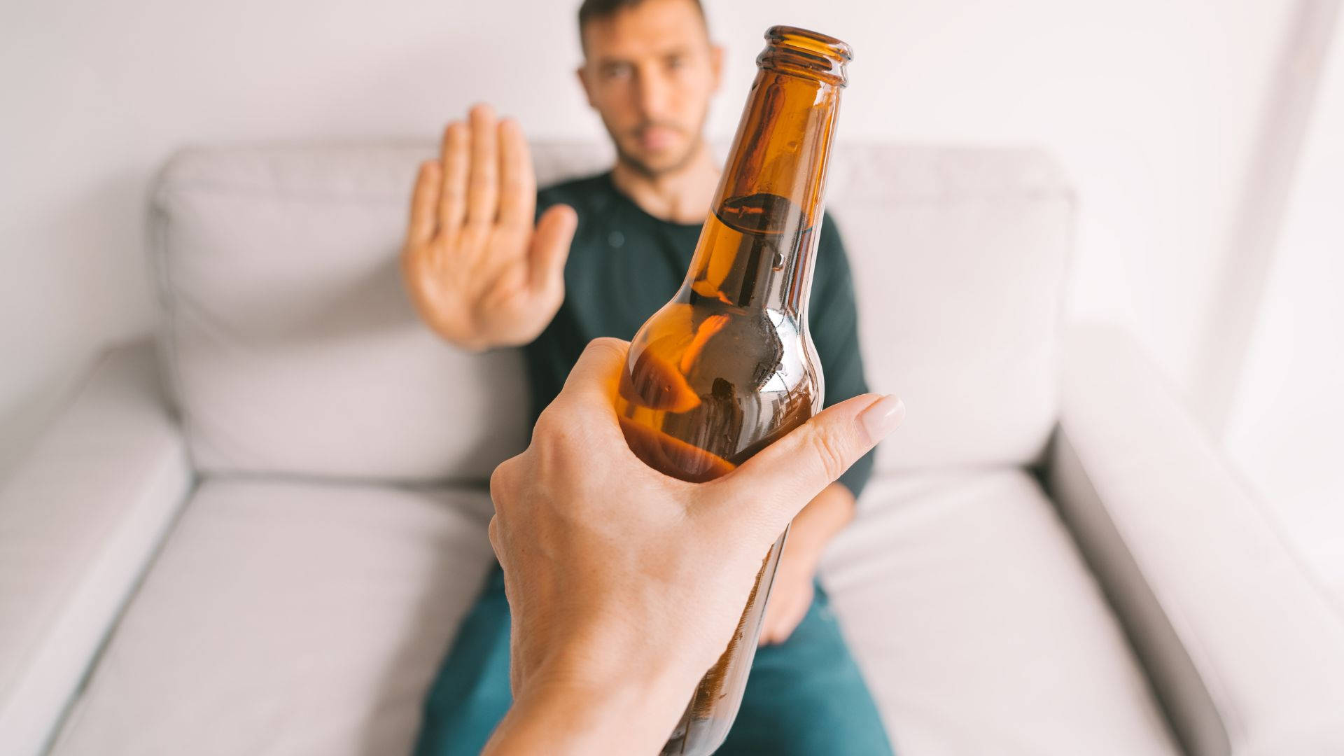 Man Rejecting A Bottle Of Alcohol Picture