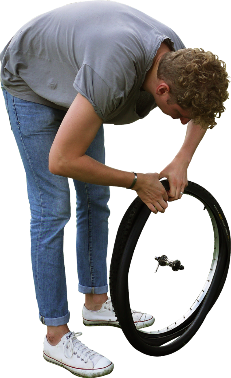 Man Repairing Bicycle Tire PNG