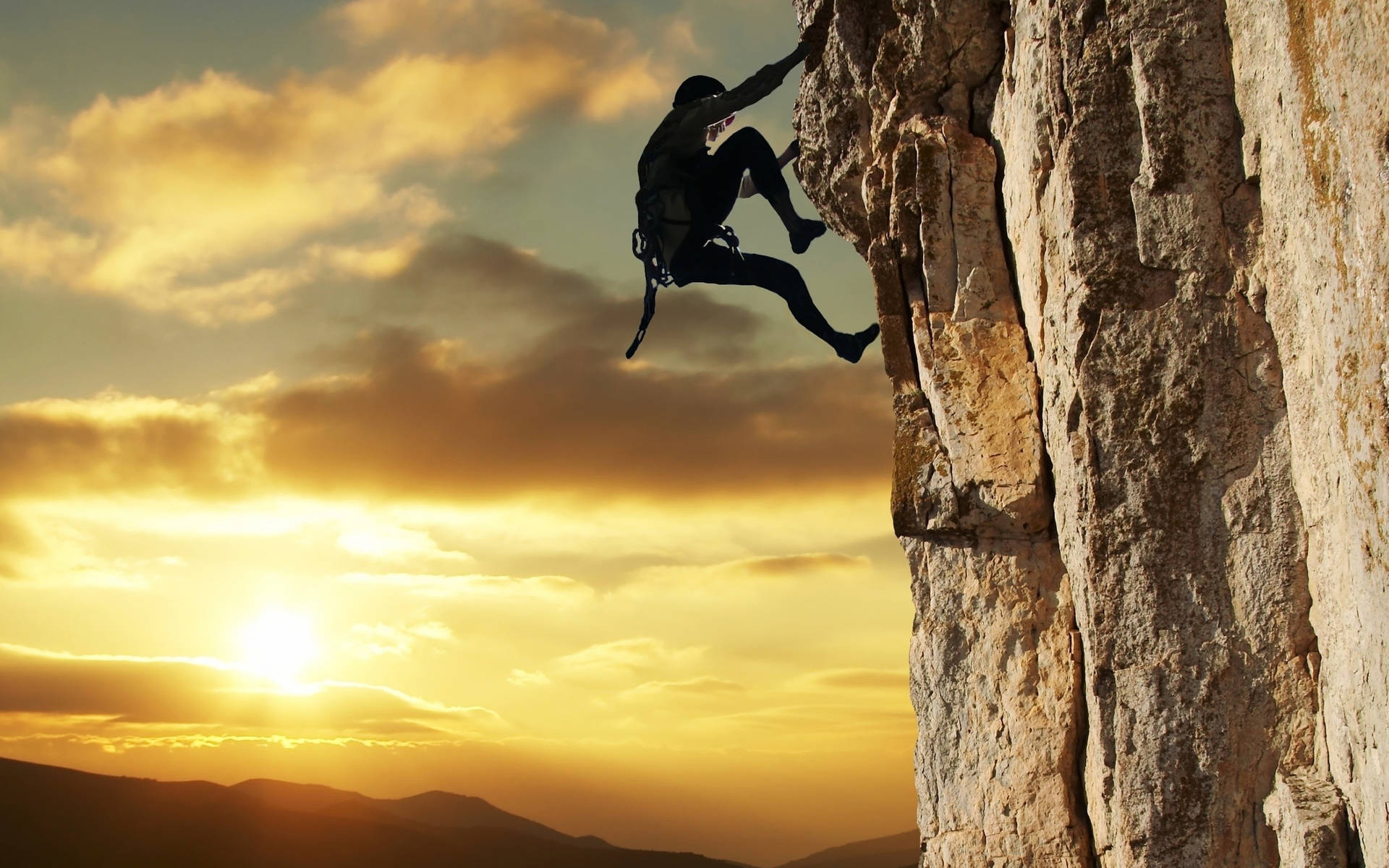 Man Rock Climbing During Sunset Wallpaper