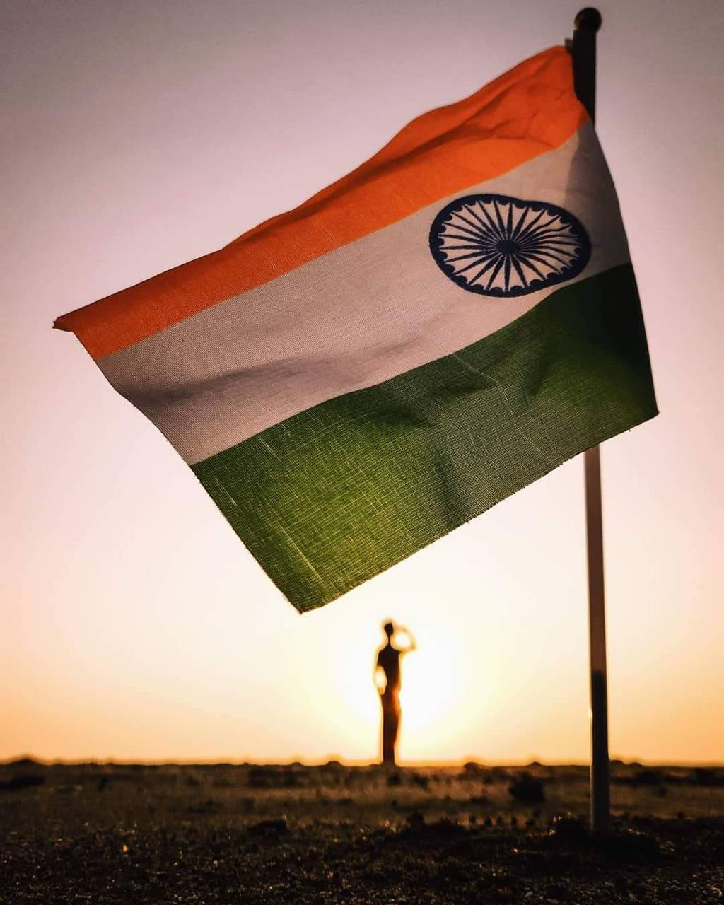 Man Saluting On The Indian Flag Background
