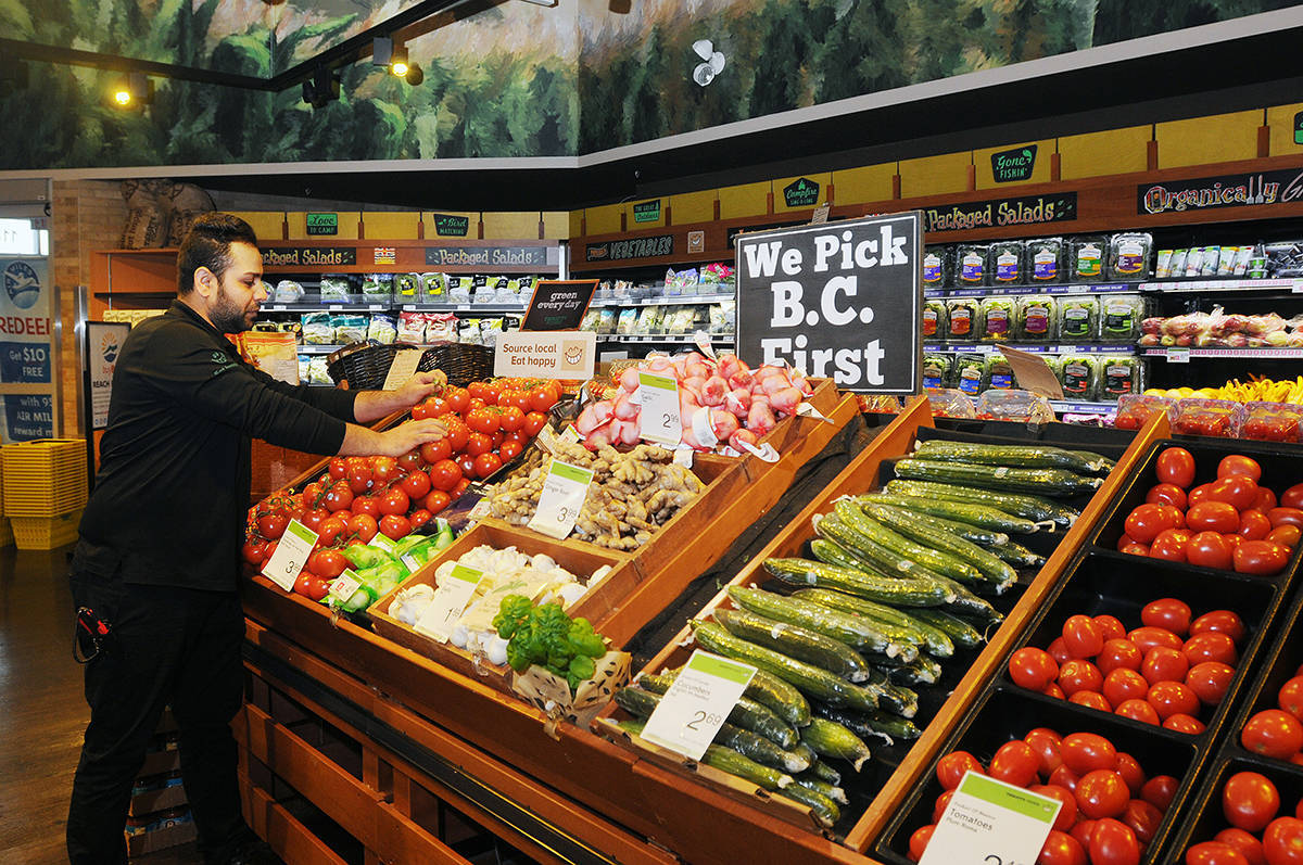 Man Shopping at Thrifty Foods Supermarket Wallpaper