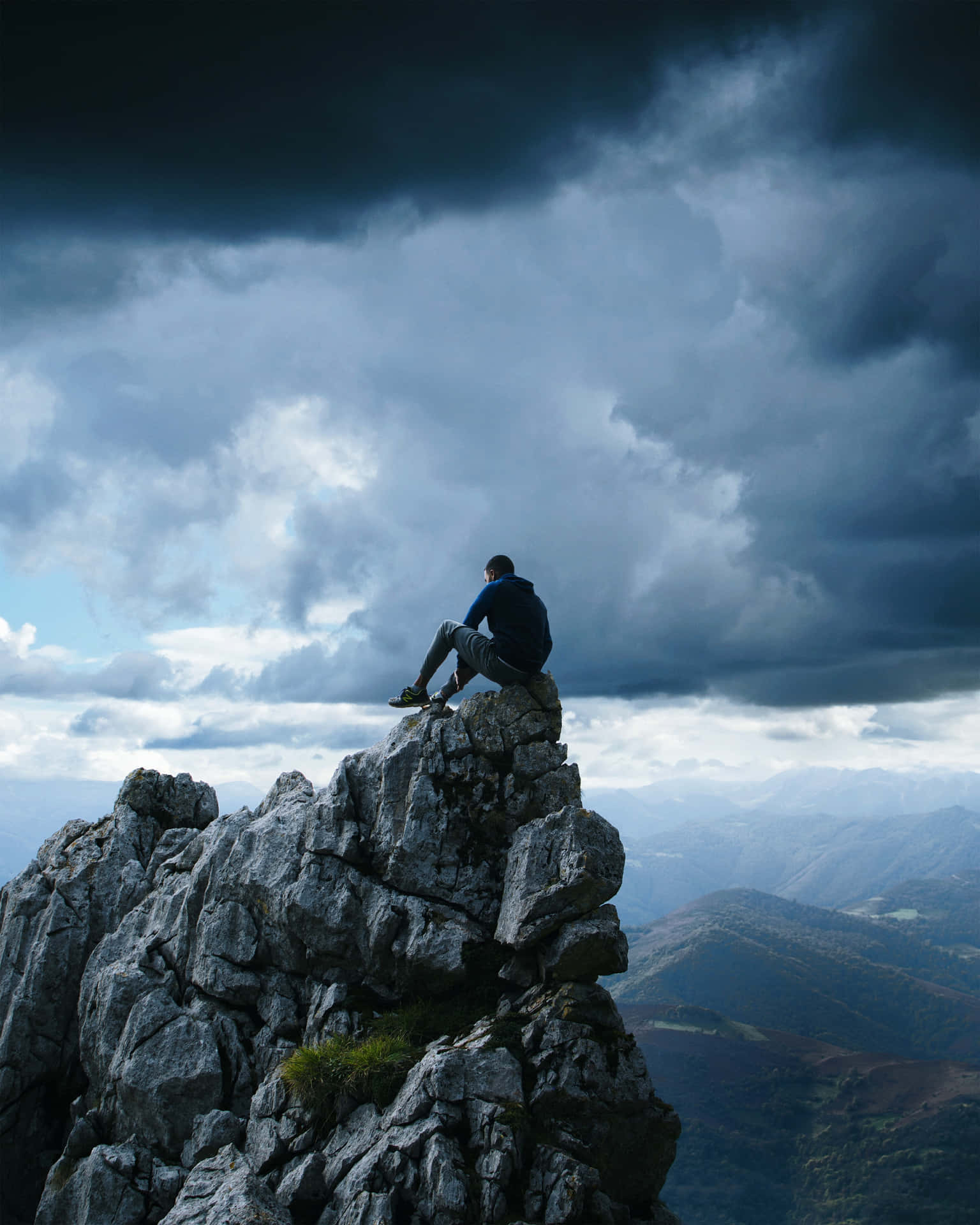 Man Sitting On Cliff Point Precipice Wallpaper