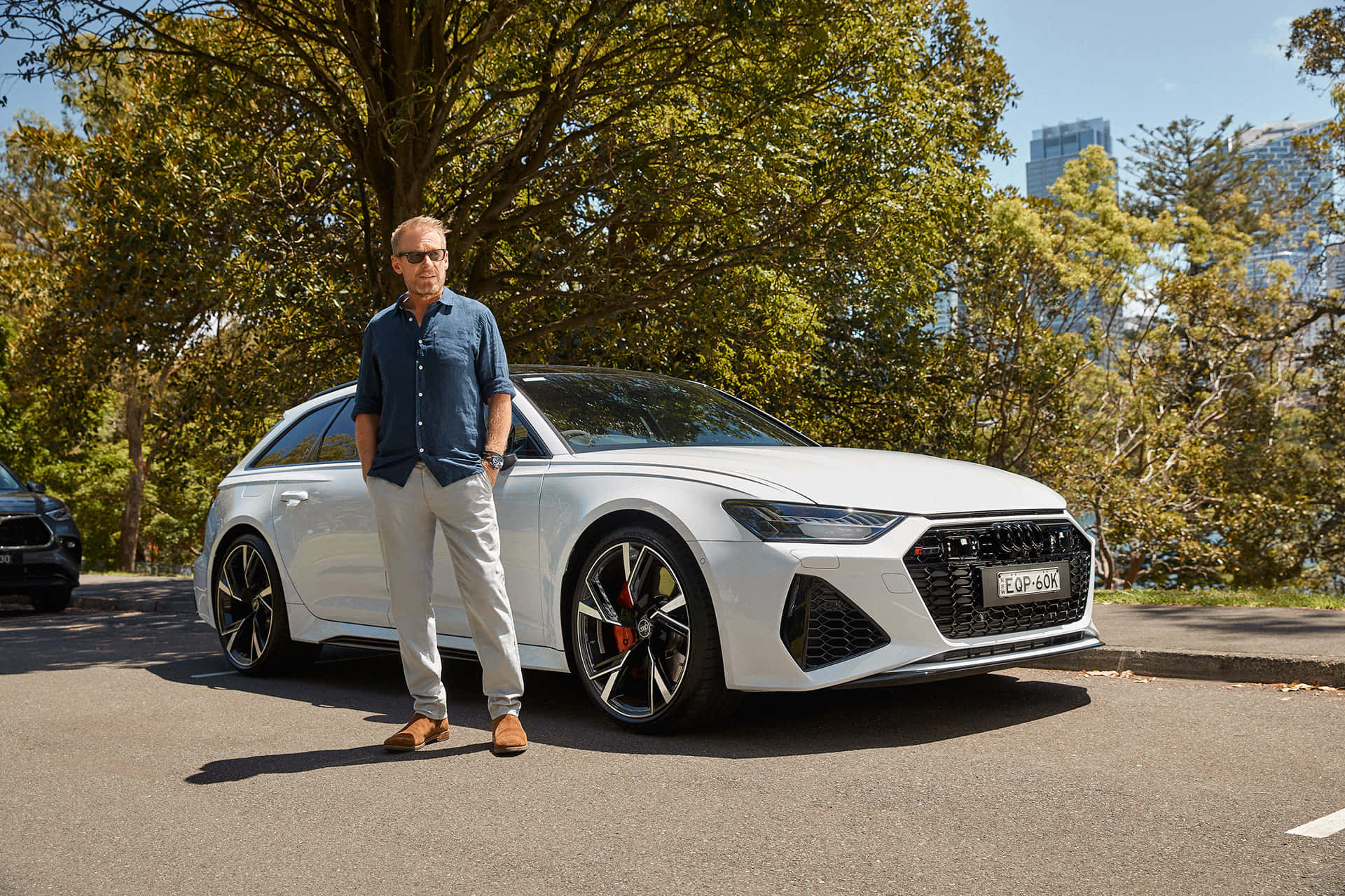 Man Standing Beside White Sports Car Wallpaper